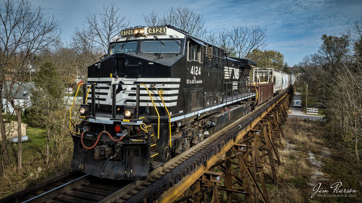 Norfolk Southern 4124 crosses Georgetown Creek over the trestle at Georgetown, Indiana, as it leads NS 168 west on November 4th, 2023, on the NS Southern East District with its mixed freight.

Tech Info: DJI Mavic 3 Classic Drone, RAW, 22mm, f/2.8, 1/1600, ISO 120.

#trainphotography #railroadphotography #trains #railways #jimpearsonphotography #trainphotographer #railroadphotographer #NSRailway #dronephoto #trainsfromadrone #IndianaTrains #GeorgeTownIN