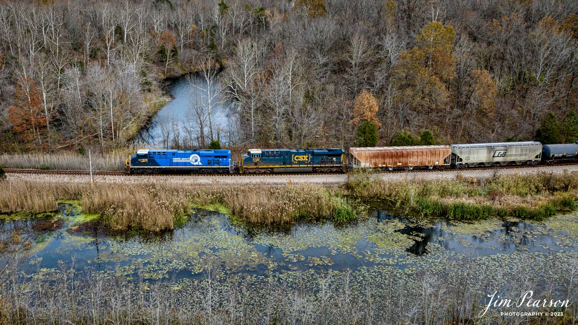 CSX Conrail Heritage Unit, CSXT 1976 leads M512 as it heads out of Earlington, Kentucky on November 9th, 2023, northbound on the CSX Henderson Subdivision on an overcast fall evening.

Tech Info: DJI Mavic 3 Classic Drone, RAW, 22mm, f/2.8, 1/200, ISO 130.

railroad, railroads train, trains, best photo. sold photo, railway, sold train photos, sold train pictures, freight trains, cargo trains, rail transport, railroad engines, pictures of trains, pictures of railways, best photograph, best photo, photography of trains, train photography, sold picture, best sold picture, CSX, CSX railroad, Kentucky trains, Jim Pearson Photography, CSX Henderson subdivision