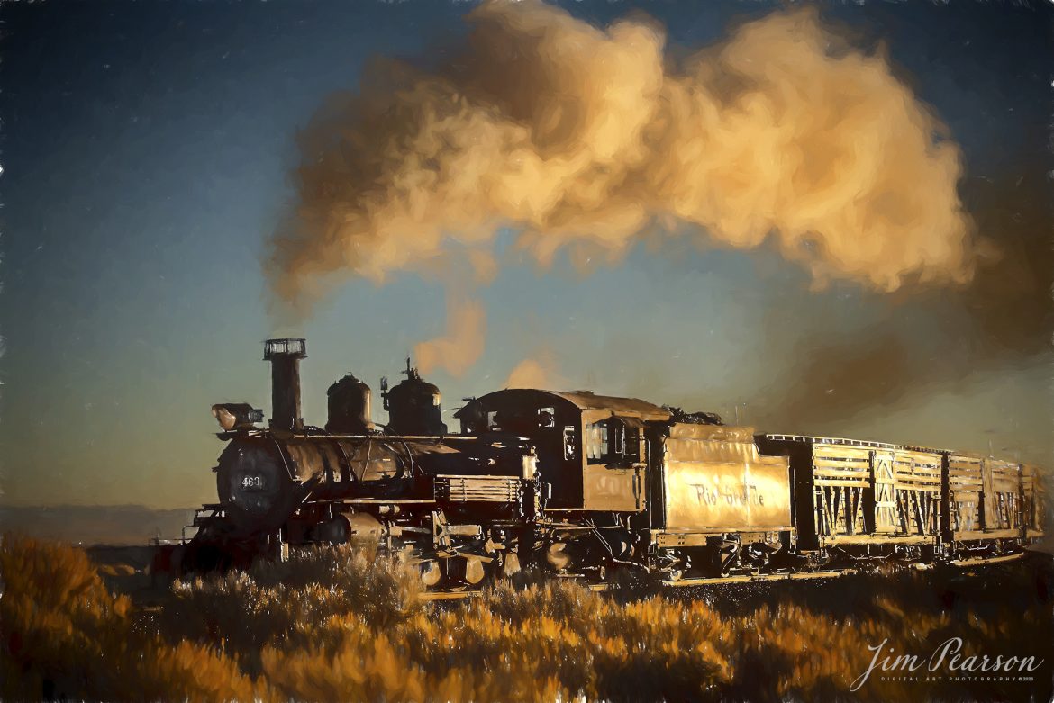 Digital Photo Art – On October 19th, 2023, the crew on Cumbres and Toltec 463 rounds a curve as glint from the rising sun illuminates their freight train during a recent photo charter, between Antonio and Osier, CO, by Dak Dillion Photography.

Tech Info: Nikon D810, RAW, Sigma 24-70 @ 29mm, f/2.8, 1/4000, ISO 360.

#trainphotographyphotoart #photoartrailroadphotography #photoarttrains #photoartrailways #trainphotographer #railroadphotographer #jimpearsonphotography #NikonD800 #digitalphotoart #steamtrain #ColoradoSteamTrain #CTSRR