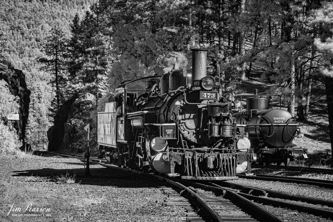 In this week’s Saturday Infrared photo, we catch Durango and Silverton steam locomotive 473 at Rockport, Colorado as it runs engine light back to Durango after performing helper duty on train bound for Silverton, on October 15th, 2023.

According to Wikipedia: The Durango and Silverton Narrow Gauge Railroad, often abbreviated as the D&SNG, is a 3 ft (914 mm) narrow-gauge heritage railroad that operates on 45.2 mi (72.7 km) of track between Durango and Silverton, in the U.S. state of Colorado. The railway is a federally designated National Historic Landmark and was also designated by the American Society of Civil Engineers as a National Historic Civil Engineering Landmark in 1968.

Tech Info: Fuji XT-1, RAW, Converted to 720nm B&W IR, Nikon 70-300 @ 70mm, f/5.6, 1/400, ISO 400.

#trainphotography #railroadphotography #trains #railways #jimpearsonphotography #infraredtrainphotography #infraredphotography #trainphotographer #railroadphotographer #infaredtrainphotography #steamtrain #dsngrr