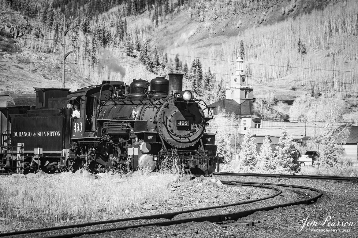 In this week’s Saturday Infrared photo, we catch Durango and Silverton steam locomotive 493 as it prepares to depart from Silverton, Colorado on October 15th, 2023.

According to Wikipedia: The Durango and Silverton Narrow Gauge Railroad, often abbreviated as the D&SNG, is a 3 ft (914 mm) narrow-gauge heritage railroad that operates on 45.2 mi (72.7 km) of track between Durango and Silverton, in the U.S. state of Colorado. The railway is a federally designated National Historic Landmark and was also designated by the American Society of Civil Engineers as a National Historic Civil Engineering Landmark in 1968.

Tech Info: Fuji XT-1, RAW, Converted to 720nm B&W IR, Nikon 70-300 @ 127mm, f/5.6, 1/950, ISO 400.

#trainphotography #railroadphotography #trains #railways #jimpearsonphotography #infraredtrainphotography #infraredphotography #trainphotographer #railroadphotographer #infaredtrainphotography #steamtrain #dsngrr