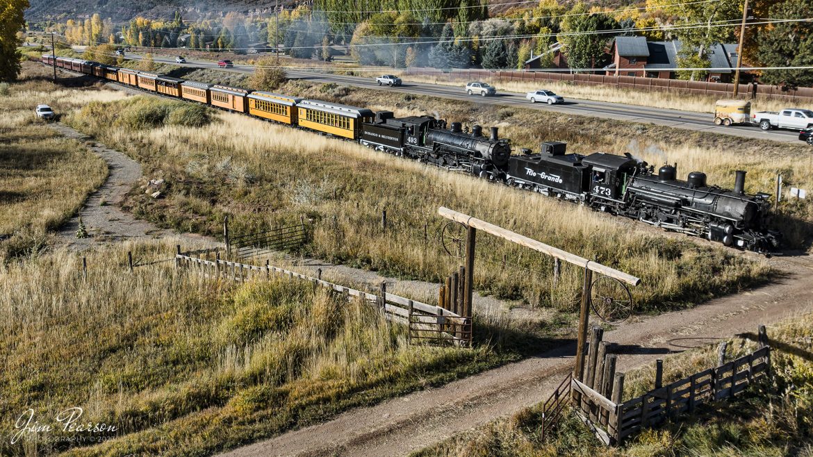 Denver and Rio Grande Western steam locomotives 473 and 493 head north alongside highway 550 as they lead a passenger train, approaching Trimble, Colorado on October 18th, 2023, on the Durango and Silverton Narrow Guage Railroad, on their way to Silverton, CO!

According to Wikipedia: The Durango and Silverton Narrow Gauge Railroad, often abbreviated as the D&SNG, is a 3 ft (914 mm) narrow-gauge heritage railroad that operates on 45.2 mi (72.7 km) of track between Durango and Silverton, in the U.S. state of Colorado. The railway is a federally designated National Historic Landmark and was also designated by the American Society of Civil Engineers as a National Historic Civil Engineering Landmark in 1968.

Tech Info: DJI Mavic 3 Classic Drone, RAW, 22mm, f/2.8, 1/1250, ISO 100.

railroad, railroads train, trains, best photo. sold photo, railway, railway, sold train photos, sold train pictures, steam trains, rail transport, railroad engines, pictures of trains, pictures of railways, best train photograph, best photo, photography of trains, steam, train photography, sold picture, best sold picture, Jim Pearson Photography, Durango and Silverton Narrow Guage Railroad, steam train, DRGWRR, Trains from the air, drone