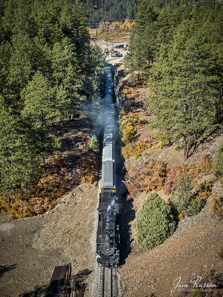 Denver and Rio Grande Western 493 leads one of the daily passenger trains as it heads through the cut at Rockwood as they head to Silverton, Colorado, on October 18th, 2023.

Interesting note is in the '69 classic, Butch Cassidy and the Sundance Kid many of the train robbery shots were done between Durango and Silverton, Colorado, where the real-life Cassidy robbed his first bank. Remember the intense train explosion scene? That was shot on the Durango & Silverton Narrow Gauge Railroad line. Also, I’m told the scene where they jumped from a cliff onto a moving train was shot at this location. Two of the D&RGW's K-28 2-8-2 locomotives were used. in “Butch Cassidy and the Sundance Kid,” #473 and. #478.

Tech Info: DJI Mavic 3 Classic Drone, RAW, 22mm, f/2.8, 1/1000, ISO 100.

railroad, railroads train, trains, best photo. sold photo, railway, railway, sold train photos, sold train pictures, steam trains, rail transport, railroad engines, pictures of trains, pictures of railways, best train photograph, best photo, photography of trains, steam, train photography, sold picture, best sold picture, Jim Pearson Photography, Durango and Silverton Narrow Guage Railroad, steam train, DRGWRR, Trains from the air, drone