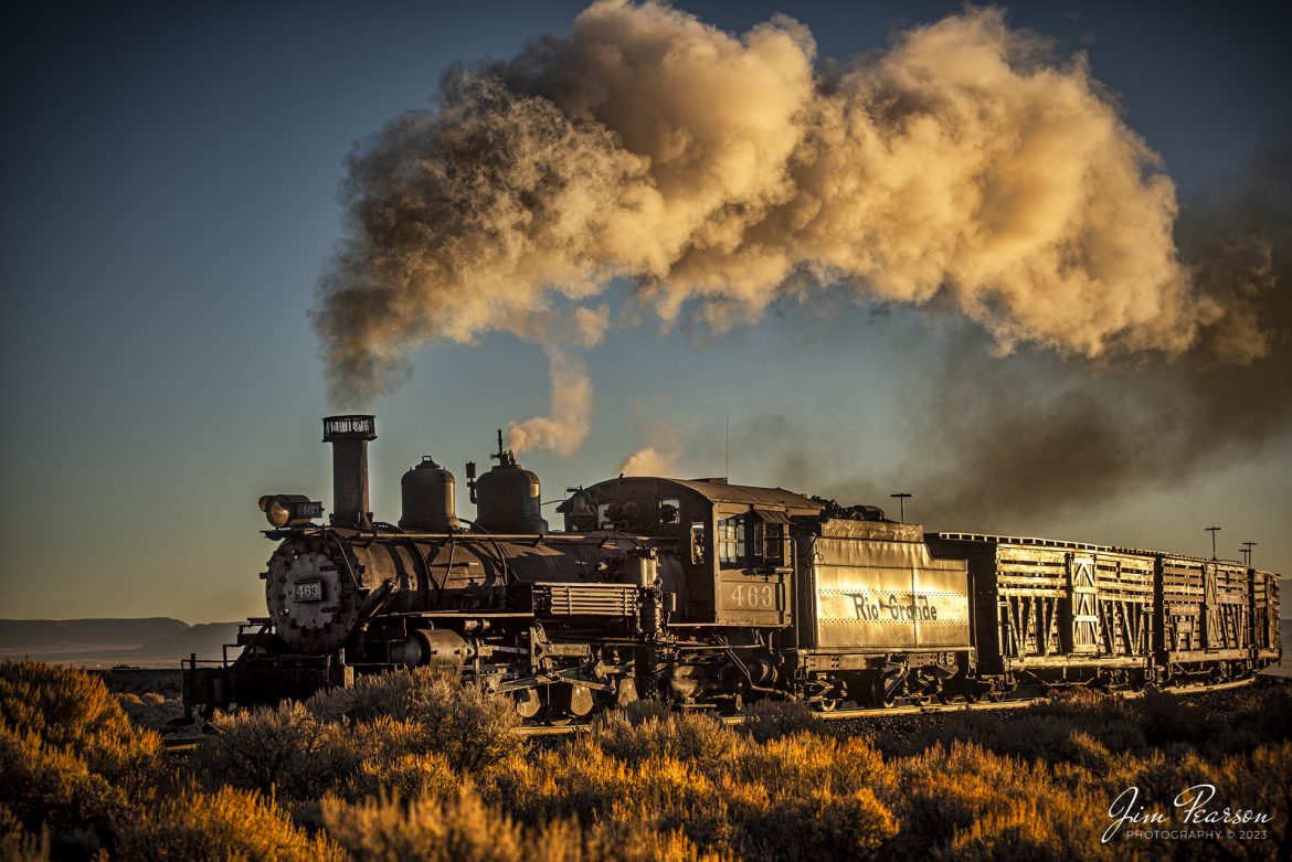 Cumbres & Toltec Scenic Railroad steam locomotive D&RGW 463 as it passes through the curve headed up to the Lava Water Tank at sunrise, between Antonito and Osier, Colorado, during a photo charter by Dak Dillon Photography on October 19th, 2023.

According to their website: the Cumbres & Toltec Scenic Railroad is a National Historic Landmark.  At 64-miles in length, it is the longest, the highest and most authentic steam railroad in North America, traveling through some of the most spectacular scenery in the Rocky Mountain West.

Owned by the states of Colorado and New Mexico, the train crosses state borders 11 times, zigzagging along canyon walls, burrowing through two tunnels, and steaming over 137-foot Cascade Trestle. All trains steam along through deep forests of aspens and evergreens, across high plains filled with wildflowers, and through a rocky gorge of remarkable geologic formations. Deer, antelope, elk, fox, eagles and even bear are frequently spotted on this family friendly, off-the grid adventure.

According to History Colorado Website: Built in 1903 by the Baldwin Locomotive Works of Philadelphia, Engine No. 463 is one of only two remaining locomotives of the K-27 series originally built for and operated by the Denver & Rio Grande Western Railroad.

The K-27 series was a departure from the design most prevalent on Colorado’s narrow-gauge lines, resulting in a locomotive with one and one-half times more power.  The arrival of this series marked a significant turning point in the operation of the D&RGW’s narrow gauge lines that was to remain in effect until the end of Class I narrow gauge steam locomotion in 1968.  The Friends of the Cumbres & Toltec Scenic Railroad restored the engine to operating condition.

Tech Info: Nikon D810, RAW, Nikon 70-300 @112mm, f/8, 1/2000, ISO 160.

#trainphotographer #railroadphotographer #jimpearsonphotography #NikonD810 #digitalphotoart #steamtrain #ColoradoSteamTrain #ctsrr