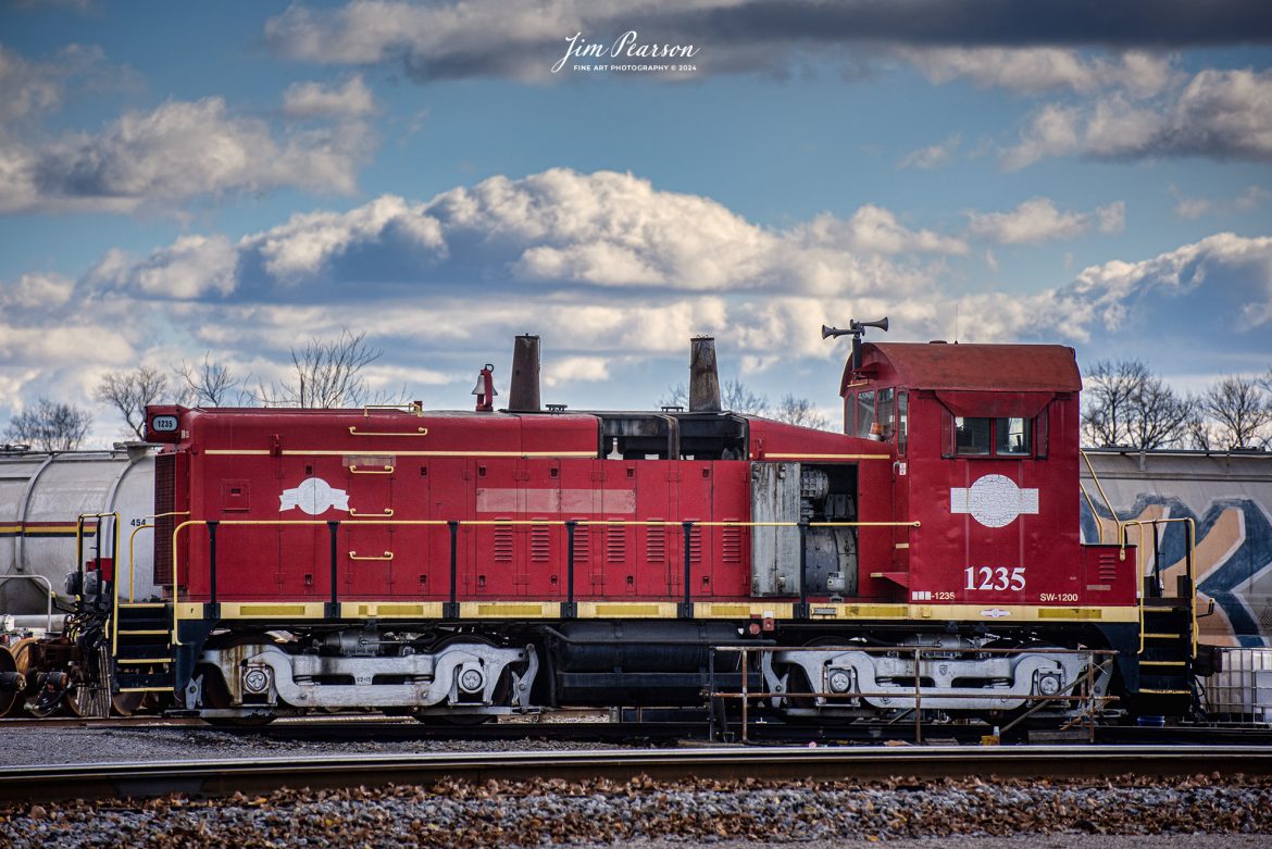 This locomotive 1235 (SW-1200), is used at the Port of Indiana at Mount Vernon, Indiana by Respondek for switching operations and I caught it at the Evansville Western yard on December 189th, 2023, where it is reportedly undergoing repairs. From what I can find online it used to belong to the Terminal Railroad Association of St. Louis (TRRA) #1235 and was acquired from them in 2008 by Respondek. 

Tech Info: Nikon D810, RAW, Nikon 70-300 @ 90mm, f/5, 1/1600, ISO 90.

#trainphotography #railroadphotography #trains #railways #trainphotographer #railroadphotographer #jimpearsonphotography #NikonD810 #IndianaTrains #EvansvilleWesternRailway