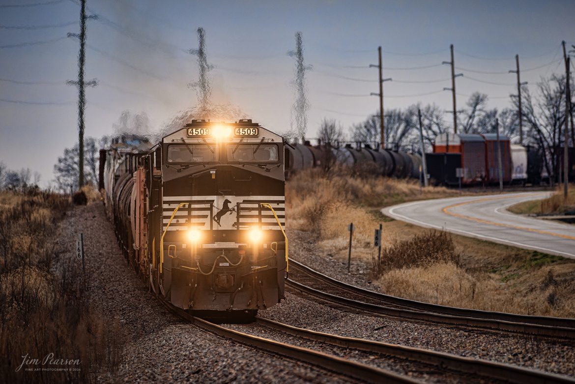 Norfolk Southern 4509 heads downgrade at MP 166 from Princeton, Indiana as it heads east as NS 167 on the NS Southern East District on January 1st, 2024, with a very long mixed freight for New Years Day.

Tech Info: Nikon D810, RAW, Sigma 150-600 @ 450mm, f/6, 1/1500, ISO 1000.

#trainphotography #railroadphotography #trains #railways #trainphotographer #railroadphotographer #jimpearsonphotography #NikonD810 #IndianaTrains #NorfolkSouthernRailway