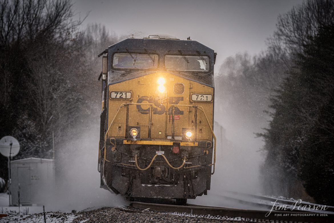 CSXT 721 leads hot intermodal I025 south on a freezing cold day at the north end of the siding at Kelly, Kentucky kicking up a cloud of snow along the way, on January 15th, 2024, on the Henderson Subdivision.

Tech Info: Nikon D810, RAW, Sigma 150-600 @ 360mm, f/5.6, 1/800, ISO 180.

#trainphotography #railroadphotography #trains #railways #trainphotographer #railroadphotographer #jimpearsonphotography #NikonD810 #KentuckyTrains #csx #trending