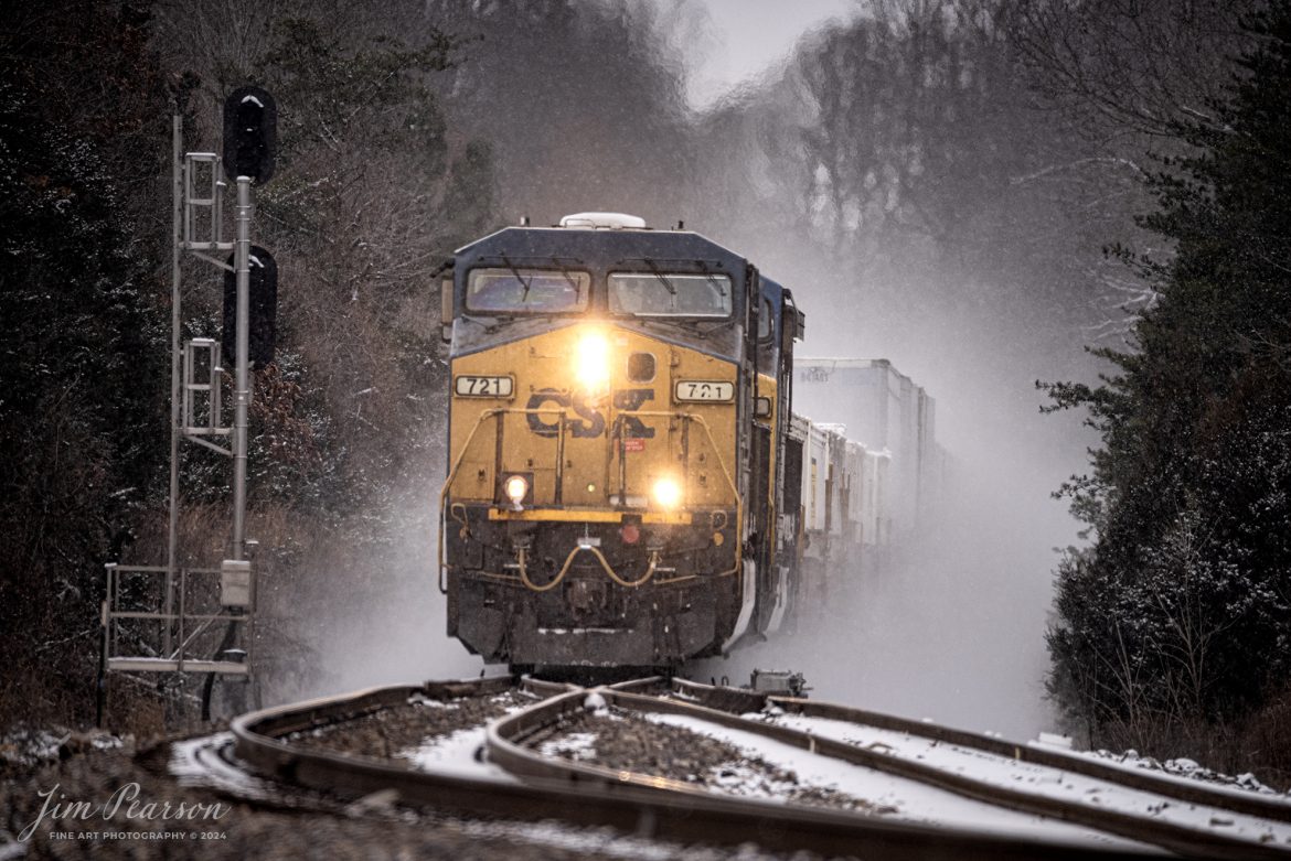 CSXT 721 leads hot intermodal I025 south on a freezing cold day as it approaches the north end of the siding at Kelly, Kentucky kicking up a cloud of snow along the way, on January 15th, 2024, on the Henderson Subdivision.

Tech Info: Nikon D810, RAW, Sigma 150-600 @ 500mm, f/6, 1/800, ISO 500.

#trainphotography #railroadphotography #trains #railways #trainphotographer #railroadphotographer #jimpearsonphotography #NikonD810 #KentuckyTrains #csx #trending