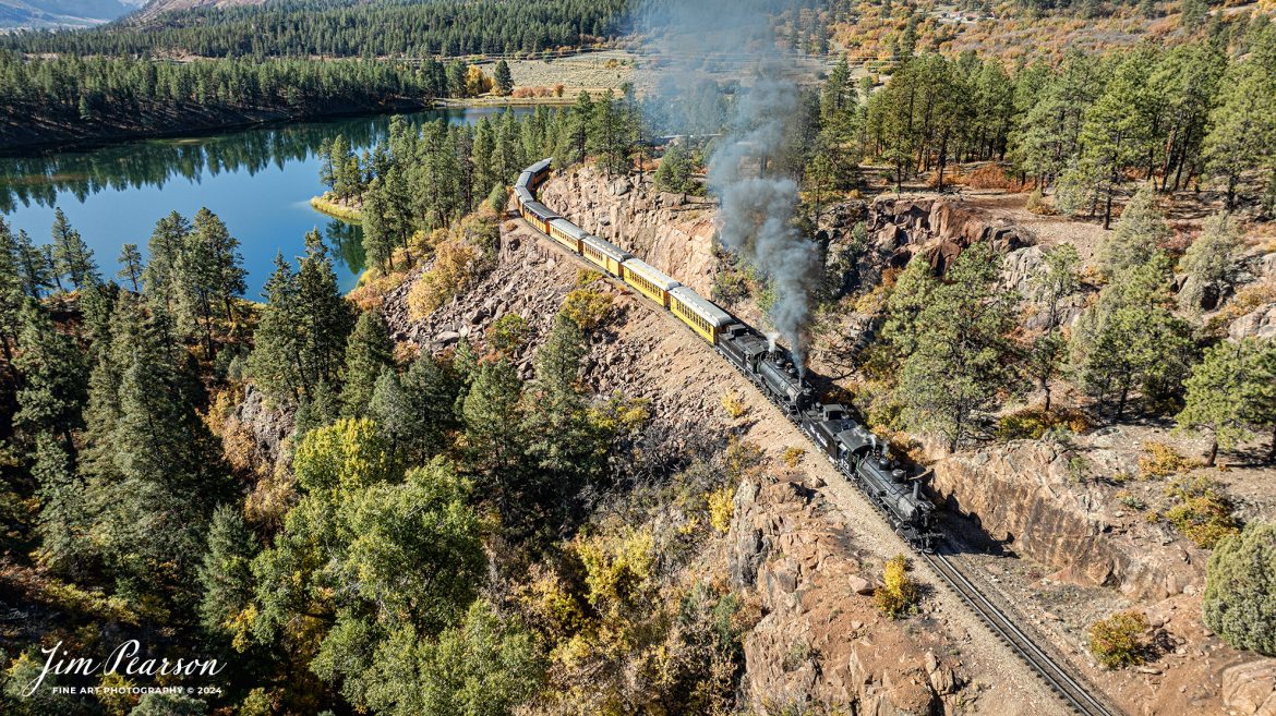 Denver and Rio Grande Western steam locomotives 473 and 493 head up a daily passenger train as they pull around the curve approaching Granite Point, just outside of Rockwood, Colorado, as they head to Silverton, CO, on October 15th, 2023, with Shalona Lake off to the left.

According to Wikipedia: The Durango and Silverton Narrow Gauge Railroad, often abbreviated as the D&SNG, is a 3 ft (914 mm) narrow-gauge heritage railroad that operates on 45.2 mi (72.7 km) of track between Durango and Silverton, in the U.S. state of Colorado. The railway is a federally designated National Historic Landmark and was also designated by the American Society of Civil Engineers as a National Historic Civil Engineering Landmark in 1968.

Tech Info: DJI Mavic 3 Classic Drone, RAW, 22mm, f/2.8, 1/640, ISO 100.

#railroad #railroads #train #trains #bestphoto #railroadengines #picturesoftrains #picturesofrailway #bestphotograph #photographyoftrains #trainphotography #JimPearsonPhotography #DurangoandSilvertonRailroad #trending