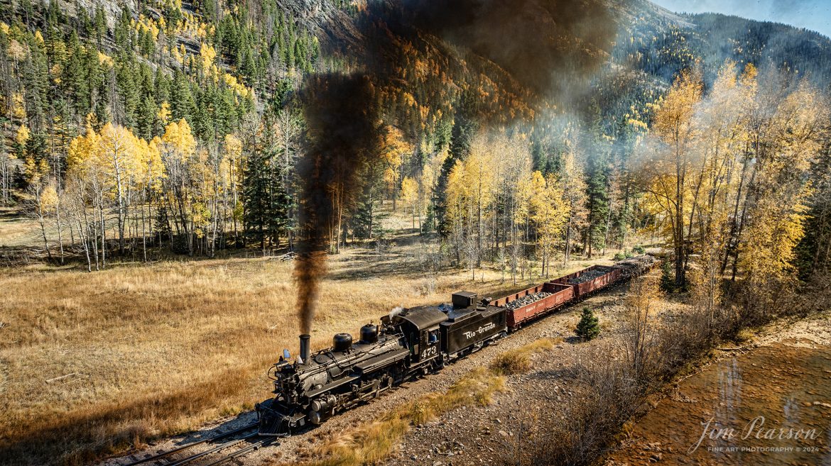 Durango and Silverton Narrow Gauge steam locomotive D&RGW 473 leads a K-28 100th Anniversary Special with a freight consist approach the wye at Elk Park, on their way to Silverton, Colorado on October 16th, 2023.

According to Wikipedia: The Durango and Silverton Narrow Gauge Railroad, often abbreviated as the D&SNG, is a 3 ft (914 mm) narrow-gauge heritage railroad that operates on 45.2 mi (72.7 km) of track between Durango and Silverton, in the U.S. state of Colorado. The railway is a federally designated National Historic Landmark and was also designated by the American Society of Civil Engineers as a National Historic Civil Engineering Landmark in 1968.

Tech Info: DJI Mavic 3 Classic Drone, RAW, 22mm, f/2.8, 1/640, ISO 110.

#railroad #railroads #train, #trains #bestphoto #soldphoto #railway #railway #soldtrainphotos #steamtrains #railtransport #railroadengines #picturesoftrains #picturesofrailways #besttrainphotograph #bestphoto #photographyoftrains #steamtrainphotography #soldpicture #bestsoldpicture #JimPearsonPhotography #DurangoandSilvertonRailroad #trending