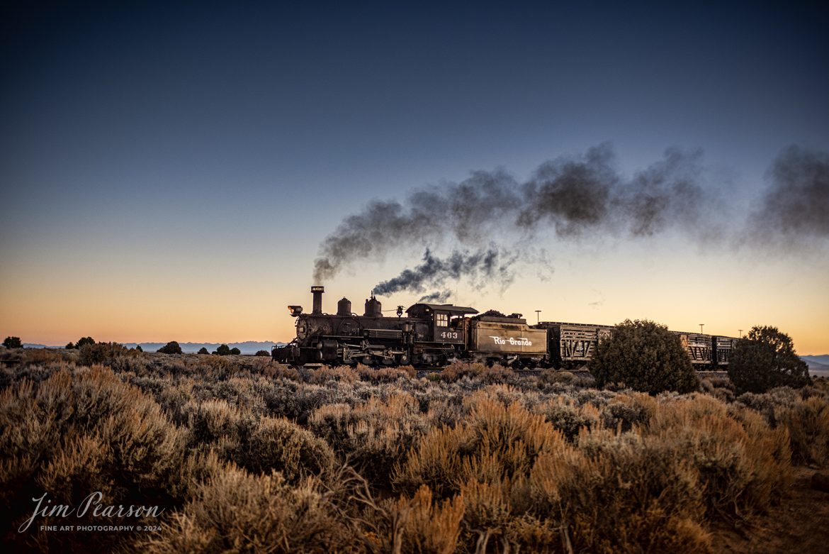 Cumbres & Toltec Scenic Railroad steam locomotive D&RGW 463 passes through the curve headed up to the Lava Water Tank at sunrise, between Antonito and Osier, Colorado, during a photo charter by Dak Dillon Photography on October 19th, 2023.

According to their website: the Cumbres & Toltec Scenic Railroad is a National Historic Landmark.  At 64-miles in length, it is the longest, the highest and most authentic steam railroad in North America, traveling through some of the most spectacular scenery in the Rocky Mountain West.

Owned by the states of Colorado and New Mexico, the train crosses state borders 11 times, zigzagging along canyon walls, burrowing through two tunnels, and steaming over 137-foot Cascade Trestle. All trains steam along through deep forests of aspens and evergreens, across high plains filled with wildflowers, and through a rocky gorge of remarkable geologic formations. Deer, antelope, elk, fox, eagles and even bear are frequently spotted on this family friendly, off-the grid adventure.

According to History Colorado Website: Built in 1903 by the Baldwin Locomotive Works of Philadelphia, Engine No. 463 is one of only two remaining locomotives of the K-27 series originally built for and operated by the Denver & Rio Grande Western Railroad.

The K-27 series was a departure from the design most prevalent on Colorado’s narrow-gauge lines, resulting in a locomotive with one and one-half times more power.  The arrival of this series marked a significant turning point in the operation of the D&RGW’s narrow gauge lines that was to remain in effect until the end of Class I narrow gauge steam locomotion in 1968.  The Friends of the Cumbres & Toltec Scenic Railroad restored the engine to operating condition.

Tech Info: Nikon D810, RAW, Sigma 24-70 @34mm, f/3.2, 1/1000, ISO 450.

#trainphotographer #railroadphotographer #jimpearsonphotography #NikonD810 #digitalphotoart #steamtrain #ColoradoSteamTrain #ctsrr