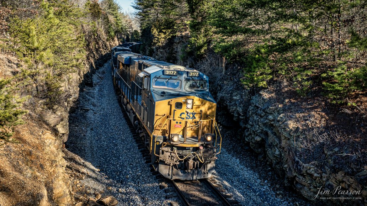 CSX 3177 leads loaded coal train, C319, as they head south through Crofton Cut, on October 5th, 2024, on the Henderson Subdivision, with their train, just north of Crofton, Kentucky. 

Tech Info: DJI Mavic 3 Classic Drone, RAW, 22mm, f/8, 1/640, ISO 220.

#trainphotography #railroadphotography #trains #railways #jimpearsonphotography #trainphotographer #railroadphotographer #dronephoto #trainsfromadrone #CSX #trending