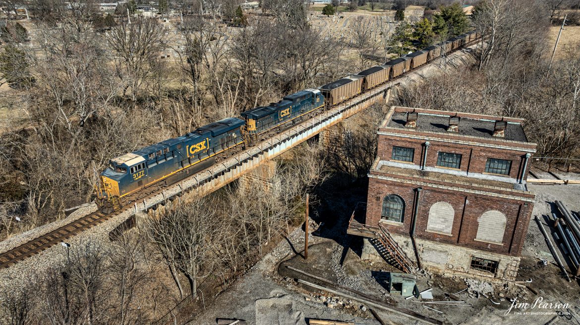 CSXT 3177 leads loaded coal train C319 as it passes over the North Fork Little River, next to the old power station at Hopkinsville, Ky on February 5th, 2024, as it heads south on the Henderson Subdivision.

Tech Info: DJI Mavic 3 Classic Drone, RAW, 22mm, f/2.8, 1/1600, ISO 110.

#trainphotography #railroadphotography #trains #railways #jimpearsonphotography #trainphotographer #railroadphotographer #csxt #dronephoto #trainsfromadrone #CSXHendersonsubdivision #trending
