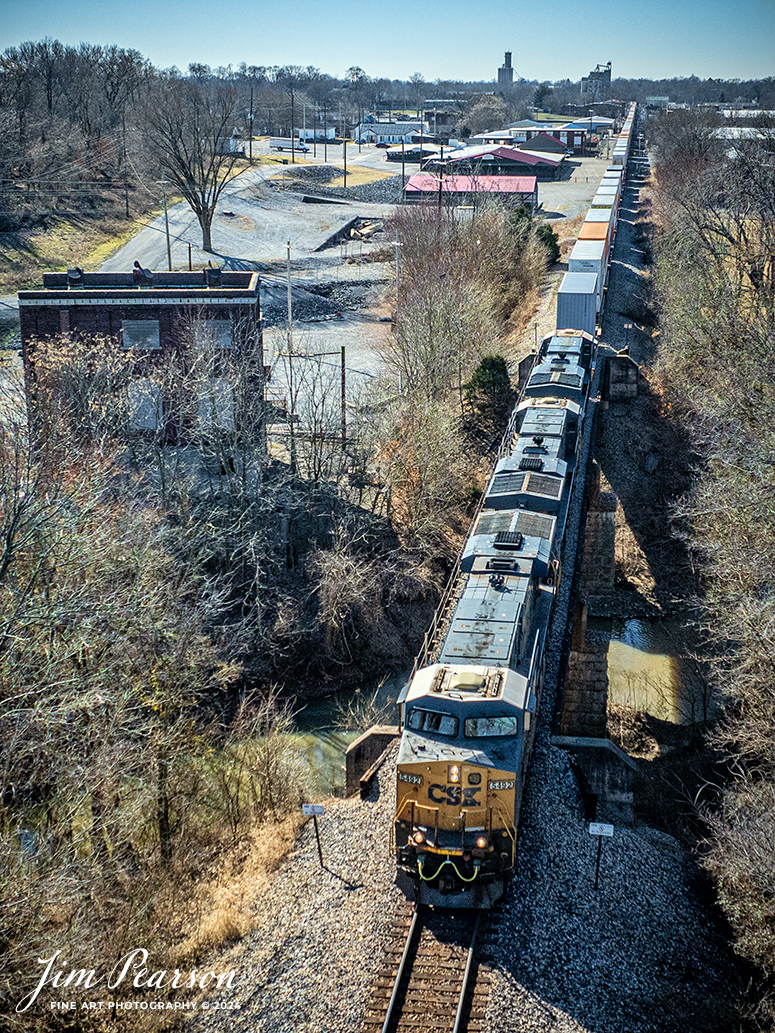 CSXT 5492 leads I128 as it passes over the North Fork Little River, next to the old power station at Hopkinsville, Ky on February 5th, 2024, as it heads north on the Henderson Subdivision.

Tech Info: DJI Mavic 3 Classic Drone, RAW, 22mm, f/2.8, 1/2500, ISO 200.

#trainphotography #railroadphotography #trains #railways #jimpearsonphotography #trainphotographer #railroadphotographer #csxt #dronephoto #trainsfromadrone #CSXHendersonsubdivision #trending