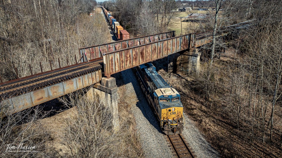 CSX 3105 leads I025 as they pass under the Paducah and Louisville Railway at the location known as Monarch on February 14th, 2024, as they head south on the Henderson Subdivision at Madisonville, Ky.

Tech Info: DJI Mavic 3 Classic Drone, RAW, 22mm, f/2.8, 1/1250, ISO 110.

#trainphotography #railroadphotography #trains #railways #jimpearsonphotography #trainphotographer #railroadphotographer #csxt #dronephoto #trainsfromadrone #CSXHendersonsubdivision #trending