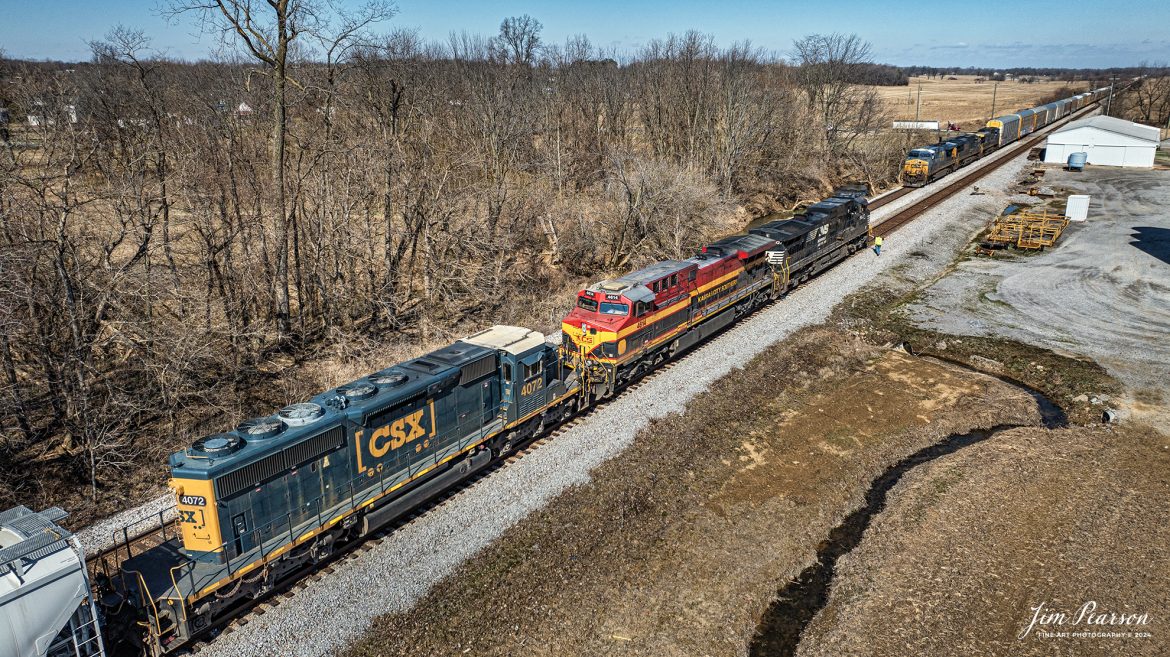 NS 9927, CPKC 4614, and CSXT 4072 on B207, a northbound loaded Phosphate train, meets hot intermodal CSX I025 at the north end of the siding at Slaughters, Ky on February 15th, 2024, on the Henderson Subdivision.

Tech Info: DJI Mavic 3 Classic Drone, RAW, 22mm, f/2.8, 1/2500, ISO 110.

#trainphotography #railroadphotography #trains #railways #jimpearsonphotography #trainphotographer #railroadphotographer #csxt #dronephoto #trainsfromadrone #CSXHendersonsubdivision #trending