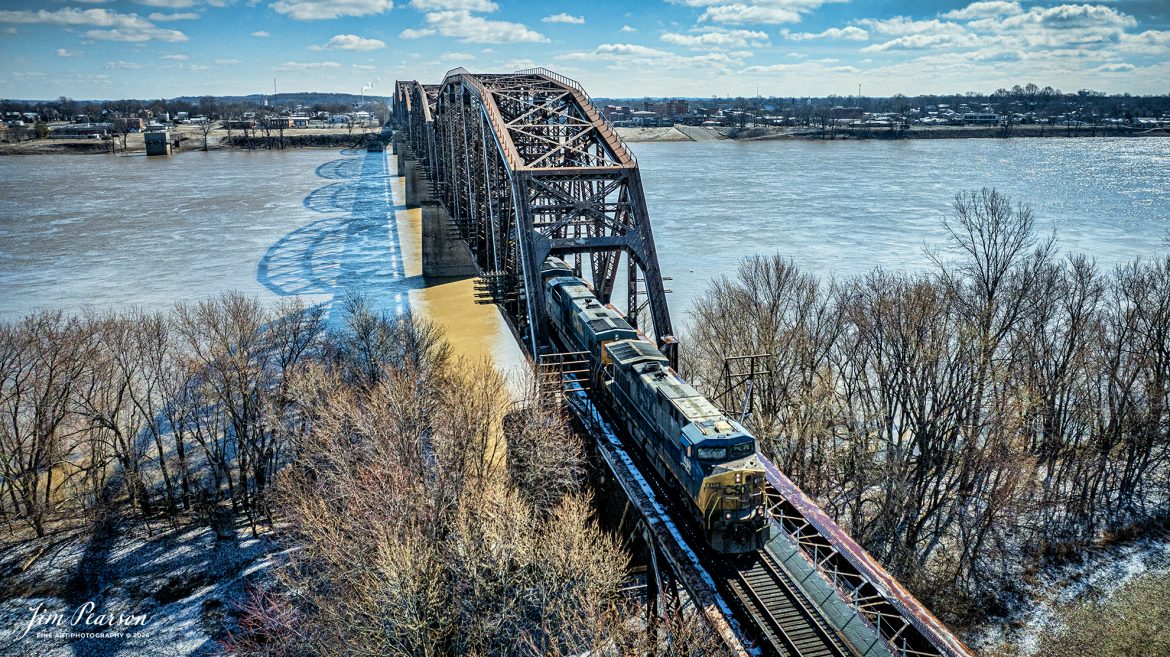 Northbound CSX 459 leads empty coal train E300 across the Ohio River from Henderson, Ky as it heads north on the Henderson Subdivision on February 17th, 2024. This train runs from Stilesboro, GA to Evansville, IN where it is passed off to the Evansville Western Railway for loading in southern Illinois.

Tech Info: DJI Mavic 3 Classic Drone, RAW, 22mm, f/8, 1/5000, ISO 220.

#trainphotography #railroadphotography #trains #railways #jimpearsonphotography #trainphotographer #railroadphotographer #dronephoto #trainsfromadrone #CSX #trending