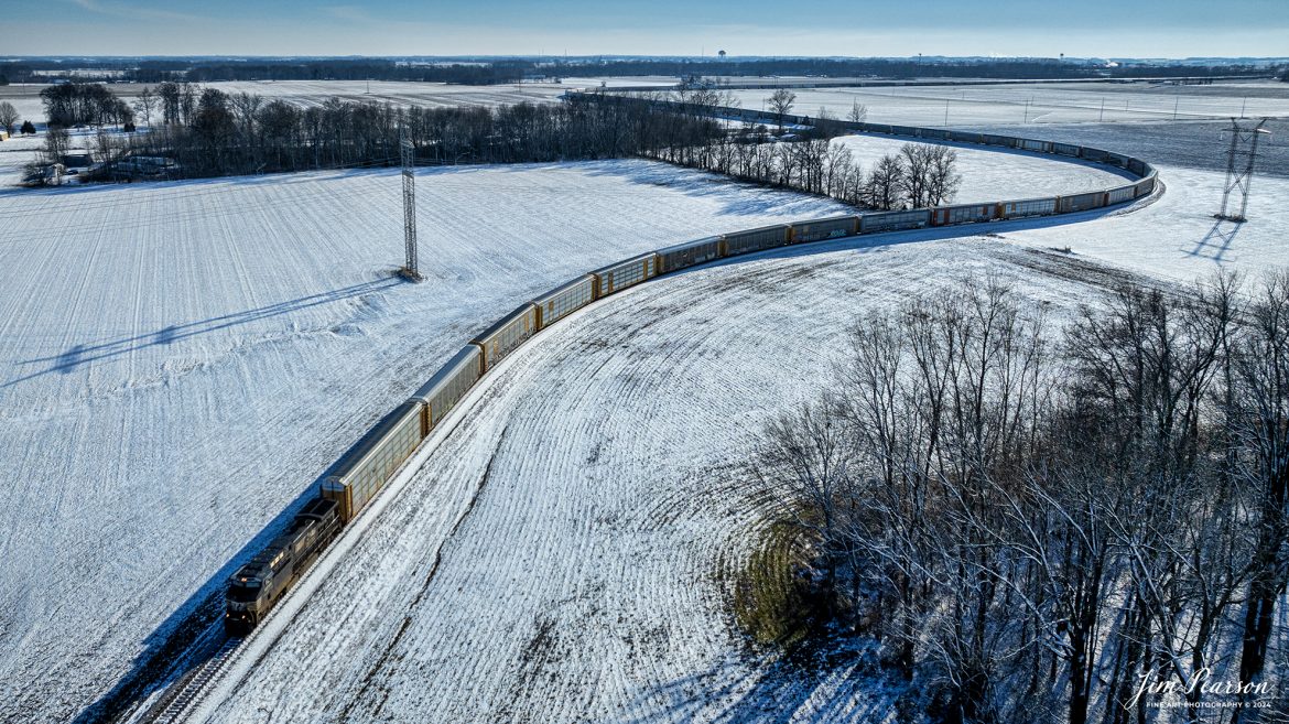 Norfolk Southern D75 backs a long set of empty autoracks through the countryside as they work on dropping them off at the Toyota plant at Princeton, Indiana on February 17th, 2024. 

Tech Info: DJI Mavic 3 Classic Drone, RAW, 22mm, f/8, 1/5000, ISO 100.

#trainphotography #railroadphotography #trains #railways #jimpearsonphotography #trainphotographer #railroadphotographer #dronephoto #trainsfromadrone #NS #norfolksouthern #trending
