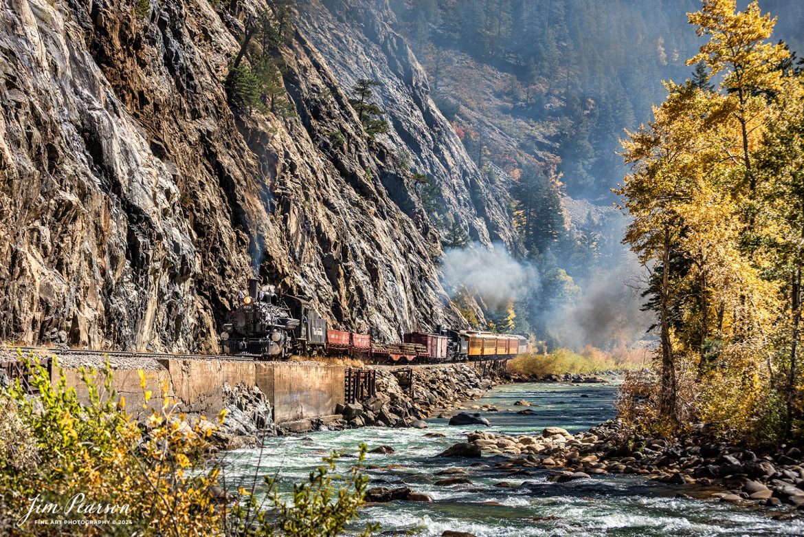 Durango and Silverton Narrow Gauge steam locomotive D&RGW 473 leads a K-28 100th Anniversary Special with D&RGW 476 as a mid-train helper through the Repeating Curves at MP 472.2, along the Animas River, between Durango and Silverton, Colorado, on October 16th, 2023.

According to Wikipedia: The Durango and Silverton Narrow Gauge Railroad, often abbreviated as the D&SNG, is a 3 ft (914 mm) narrow-gauge heritage railroad that operates on 45.2 mi (72.7 km) of track between Durango and Silverton, in the U.S. state of Colorado. The railway is a federally designated National Historic Landmark and was also designated by the American Society of Civil Engineers as a National Historic Civil Engineering Landmark in 1968.

Tech Info: Nikon D810, RAW, Sigma 24-70 @ 24mm, f/5.6, 1/1000, ISO 250.

railroad, railroads train, trains, best photo. sold photo, railway, railway, sold train photos, sold train pictures, steam trains, rail transport, railroad engines, pictures of trains, pictures of railways, best train photograph, best photo, photography of trains, steam, train photography, sold picture, best sold picture, Jim Pearson Photography, Durango and Silverton Narrow Guage Railroad, steam train, drgwrr