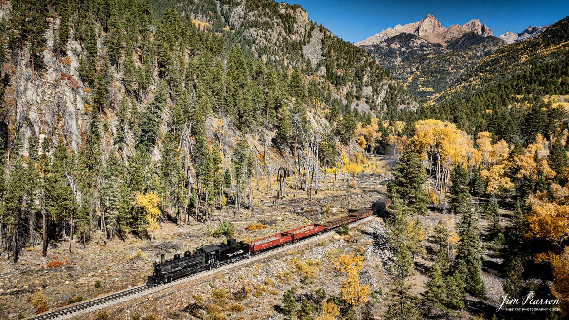 Durango and Silverton Narrow Gauge steam locomotive D&RGW 473 pulls a K-28 100th Anniversary Special as it heads to Durango, Colorado from Goblin Fire (480.5) with Pigeon and Turret Peaks in the distance, on October 16th, 2023.

According to Wikipedia: The Durango and Silverton Narrow Gauge Railroad, often abbreviated as the D&SNG, is a 3 ft (914 mm) narrow-gauge heritage railroad that operates on 45.2 mi (72.7 km) of track between Durango and Silverton, in the U.S. state of Colorado. The railway is a federally designated National Historic Landmark and was also designated by the American Society of Civil Engineers as a National Historic Civil Engineering Landmark in 1968.

Tech Info: DJI Mavic 3 Classic Drone, RAW, 22mm, f/2.8, 1/1250, ISO 100.

railroad, railroads train, trains, best photo. sold photo, railway, railway, sold train photos, sold train pictures, steam trains, rail transport, railroad engines, pictures of trains, pictures of railways, best train photograph, best photo, photography of trains, steam, train photography, sold picture, best sold picture, Jim Pearson Photography, Durango and Silverton Narrow Guage Railroad, steam train, drgwrr