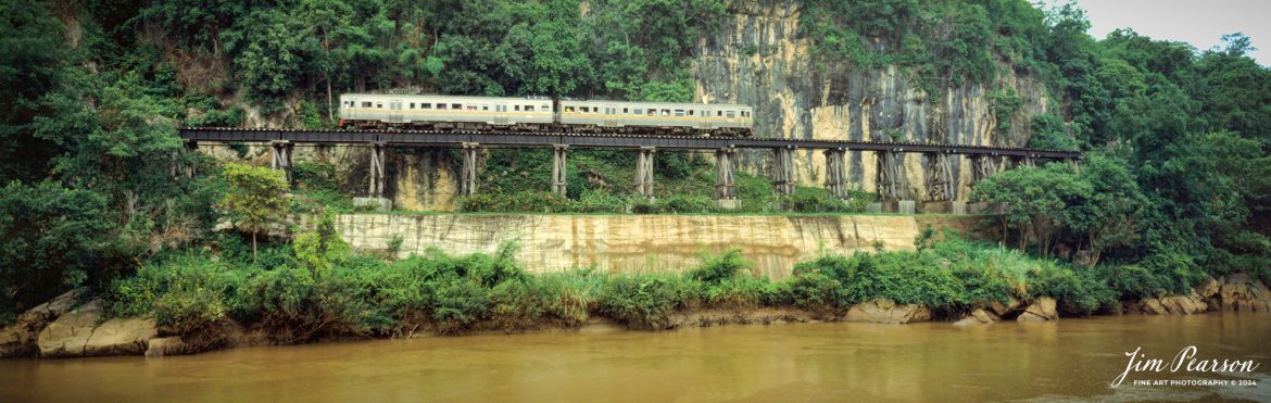I took a ride along the Thai-Burma Railway (Death Railway) – by special diesel railcar 171 back around 1988 where I rode on nearly 50 miles (77 kilometers) of the original 258-mile (415-kilometer) long Thai-Burma Railway. The roundtrip train trip from Kanchanaburi Station, across the River Kwai Bridge to Nam Tok Station took about two hours and crossed though some of the most scenic territory in all of Thailand. My trip, however, took a bit longer as I got off at Nam Tok to photograph scenes such as this one of trains. 

During WW II, Japan constructed this meter-gauge railway line from Ban Pong, Thailand to Thanbyuzayat, Burma. The line passing through the scenic Three Pagodas Pass runs for 250 miles. This is now known as the Death Railway.

The railway line was meant to transport cargo daily to India, to back up their planned attack on India. The construction was done using POWs and Asian slave laborers in unfavorable conditions. The work started in October 1942 and was completed in a year. Due to the difficult terrain, thousands of laborers lost their lives. It is believed that one life was lost for each sleeper laid in the track.

At the nearby Kanchanaburi War Cemetery, around 7,000 POWs, who sacrificed their lives in the railway construction, are buried. Another 2,000 are laid to rest at the Chungkai Cemetery.

This line has the River Kwai Bridge which became famous all over the world, when it was featured in movies and books. The cliff-hugging tracks and the natural beauty of the surrounding mountains and valleys were well captured in the David Lean movie.

I plan on publishing scans from images that I’ve shot in the past on Saturday’s at 5pm CST so check back then to see more images from around the world from my past travels!

Fuji 6x17, Fuji 105mm lens, other exposure information wasn’t recorded back then.

#trainphotography #railroadphotography #trains #railways #jimpearsonphotography #panphotography #6x17photography #trainphotographer #railroadphotographer #Thailand #deathrailway
