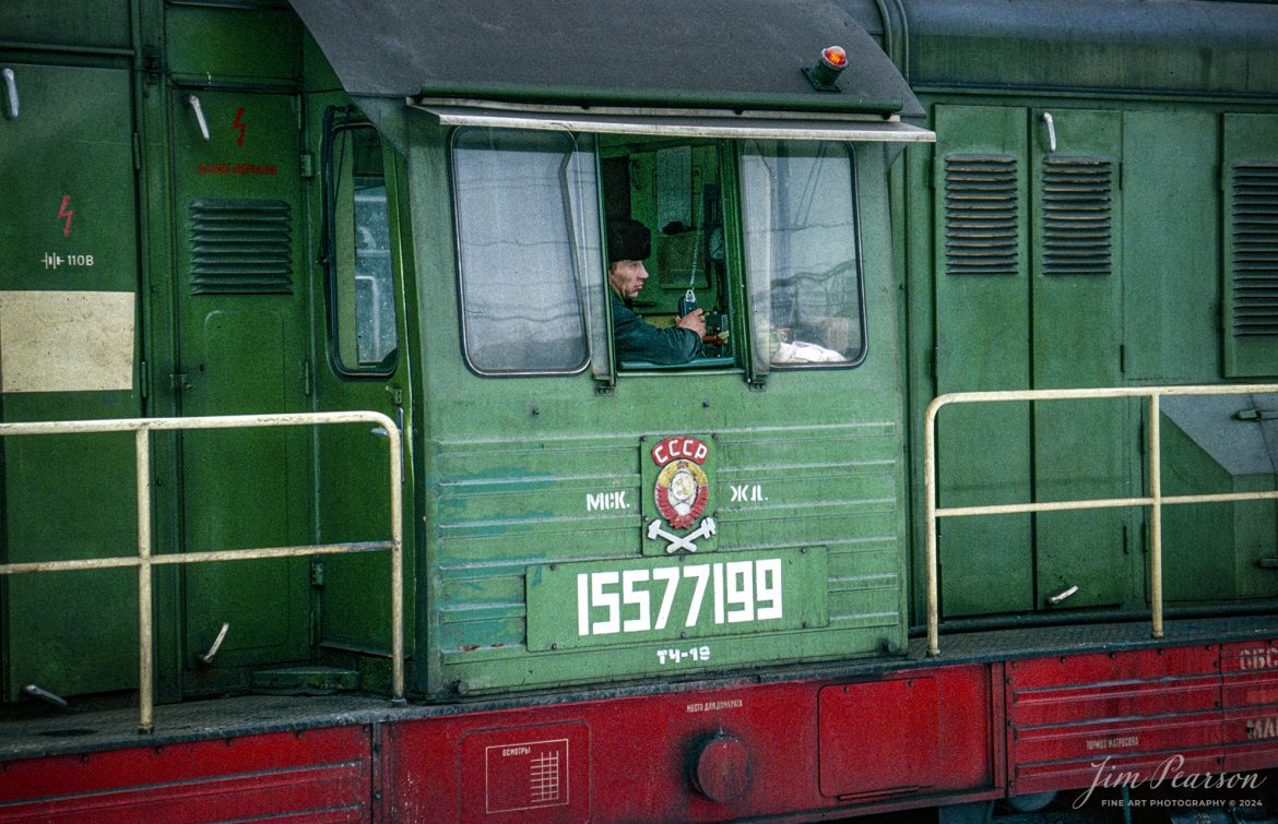 The engineer on Russian Diesel locomotive 15577199 waits for permission to depart from the yards at Moscow, Russia sometime during the winter months of 1992. This image is from a slide scan that I shot while I was taking part in a military humanitarian called Provide Hope.

For awhile I was the non-commissioned officer in charge of the Air Force’s Electronic Imaging Center stationed at Aviano, Italy, where Combat Camera was tasked to document the Provide Hope operation. I was there for six months, and we flew missions in and out of the USSR. This was on one trip to Moscow where we spent a couple days in the country, documenting the delivery of supplies to an orphanage. Of course, during my off time, I made sure to visit the train station that was just outside our hotel! 

According to Wikipedia:  Operation Provide Hope was a humanitarian operation conducted by the U.S. Air Force to provide medical equipment to former Soviet republics during their transition to capitalism. The operation was announced by Secretary of State James A. Baker, III on January 22–23, 1992 and the initial shipment of supplies was sent on February 10, 1992. Twelve US Air Force C-5 and C-141 was carrying an estimated 500 tons of bulk-food rations and medicines into Moscow, St. Petersburg, Kyiv, Minsk, and Chisinau from Germany and Yerevan, Almaty, Dushanbe, Ashkhabad, Baku, Tashkent, and Bishkek from Turkey. In total, for nearly two weeks sixty-five missions flew 2,363 short tons (2,144 t) of food and medical supplies to 24 locations in the Commonwealth of Independent States during the initial phase of operation. Much of these supplies was left over from the buildup to the Persian Gulf War.

Small teams of US personnel from various government agencies (On-Site Inspection Agency, USAID, and USDA) had been placed in each destination shortly before the deliveries, to coordinate with local officials and to monitor to the best extent possible that the deliveries reached the intended recipients (i.e., orphanages, hospitals, soup kitchens, and needy families).

#trainphotography #railroadphotography #trains #railways #jimpearsonphotography #trainphotographer #railroadphotographer #Russia #Moscow