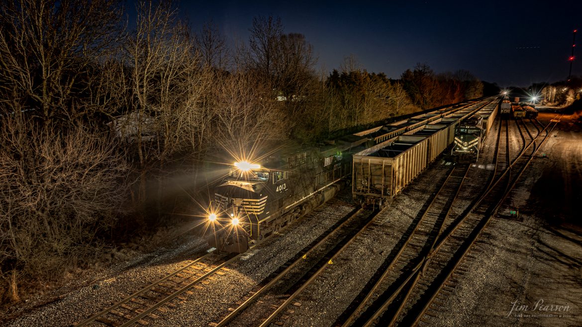 Norfolk Southern 4013 prepares to move south from the Paducah and Louisville Railway yard at Madisonville, Ky on the evening of March 2nd, 2024, as it heads to the Warrior Coal loop at Nebo, Ky to pick up another load of coal.

Tech Info: DJI Mavic 3 Classic Drone, RAW, 22mm, f/5.6, 8 seconds, ISO 100.

#trainphotography #railroadphotography #trains #railways #jimpearsonphotography #trainphotographer #railroadphotographer #dronephoto #trainsfromadrone #KentuckyTrains #trending #trainsatnight