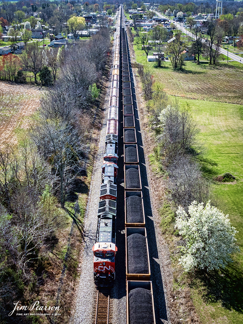 Canadian National (CN) locomotive 3233 (Support our Troops) leads B229-13 as they wait in the siding for loaded coal train CSX C002 headed south at the north end of Crofton, Kentucky, on the CSX Henderson Subdivision, March 16th, 2024.

From a CN Press Release: “CN’s two tribute locomotives (CN 3233 & 3015) pay homage to veterans and active military men and women across North America. Their custom design represents the proud footprint we have established across our network and our deep recognition for the veterans who live and work in the communities our trains pass through every day. 

Tech Info: DJI Mavic 3 Classic Drone, RAW, 22mm, f/2.8, 1/3200, ISO 180.

#trainphotography #railroadphotography #trains #railways #jimpearsonphotography #trainphotographer #railroadphotographer #csxt #dronephoto #trainsfromadrone #trending #csxhendersonsubdivision #cnrailway