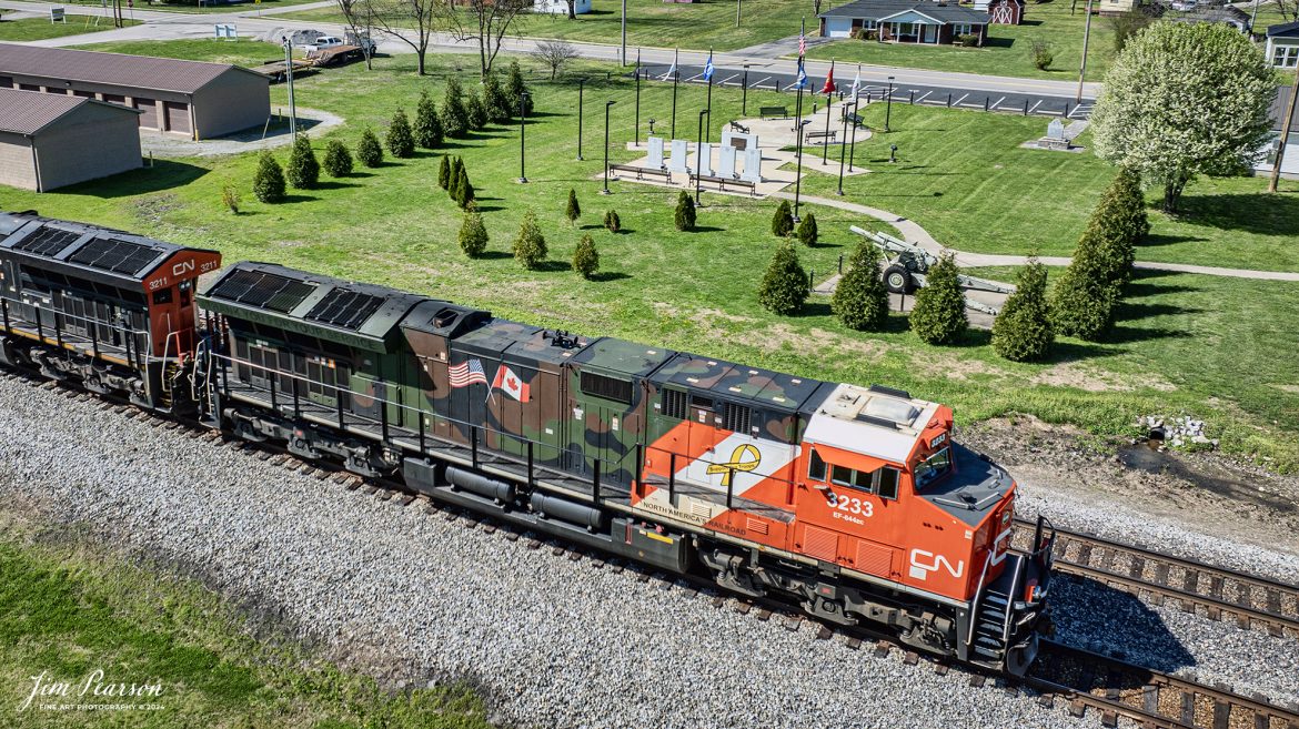 Canadian National (CN) locomotive 3233 (Support our Troops) heads north on the CSX Henderson Subdivision leading as it passes the Veterans Memorial Park at Crofton, Kentucky, on March 16th, 2024.

From a CN Press Release: “CNs two new tribute locomotives (CN 3233 & 3015) pay homage to veterans and active military men and women across North America. Their custom design represents the proud footprint we have established across our network and our deep recognition for the veterans who live and work in the communities our trains pass through every day. Stay tuned as they make their debut on our main line in the coming days!”

Tech Info: DJI Mavic 3 Classic Drone, RAW, 22mm, f/2.8, 1/1250, ISO 100.

#trainphotography #railroadphotography #trains #railways #jimpearsonphotography #trainphotographer #railroadphotographer #csxt #dronephoto #trainsfromadrone #trending #csxhendersonsubdivision