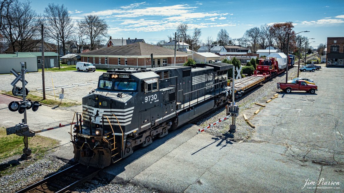 Norfolk Southern 3730 leads CSX S991 with an oversized Turbine load from Siemens Energy on a depressed flatbed northbound from through downtown Ft. Branch, IN, on the CSX CE&D Subdivision, on March 20th, 2024. 

B229 originated at Birmingham, AL and is headed for New Castle, PA. I caught this move just north of Evansville, IN and gave chase to Patoka, Indiana. 

Tech Info: DJI Mavic 3 Classic Drone, RAW, 22mm, f/2.8, 1/2500, ISO 110.

#trainphotography #railroadphotography #trains #railways #jimpearsonphotography #trainphotographer #railroadphotographer #csxt #dronephoto #trainsfromadrone #trending #csxcedsubdivision #norfolksouthern #trending