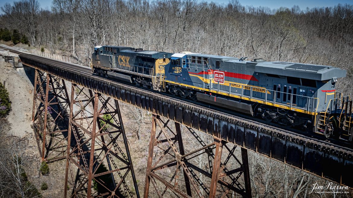 CSX B211, a loaded potash train, heads north across Gum Lick Trestle, just north of Kelly, Kentucky, with CSX Heritage Unit L&N 1972 Family Lines System trailing CSXT 62 northbound, on March 28th, 2024, on the Henderson Subdivision. This is the first time I’ve photographed this unit and though I wish it was leading, I’ll take it anyway it comes! You’ll see several shots of this move this week, so stay tuned!

According to CSXT: Our fleet of heritage locomotives is growing again as we unveil CSX Locomotive 1972, a tribute to the Family Lines System! The #ONECSX team in Waycross, GA recreated this unit to celebrate the special time from 1972-1982 when the Seaboard Coast Line, Clinchfield and L&N railroads were marketed as one. Eventually merging to become the Seaboard System Railroad, and ultimately the CSX we know today, the Family Lines System represents an integral part of our railroad’s rich history.
The CSX heritage series is reinforcing employee pride in the history of the railroad that continues to move the nation’s economy with safe, reliable, and sustainable rail-based transportation services.

Tech Info: DJI Mavic 3 Classic Drone, RAW, 22mm, f/2.8, 1/2500, ISO 140.

#railroad #railroads #train #trains #bestphoto #railroadengines #picturesoftrains #picturesofrailway #bestphotograph #photographyoftrains #trainphotography #JimPearsonPhotography #csxheritageunit #trainsfromadrone #tending
