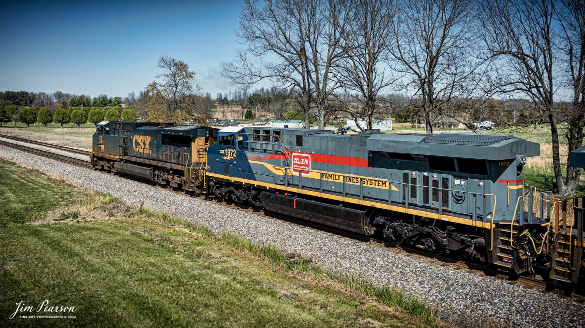 CSX B211, a loaded potash train, heads north from Crofton, Kentucky, with CSX Heritage Unit L&N 1972 Family Lines System trailing CSXT 62 northbound, on March 28th, 2024, on the Henderson Subdivision. This chase was the first time I’ve photographed this unit and though I wish it was leading, I’ll take it anyway it comes! 

According to CSXT: Our fleet of heritage locomotives is growing again as we unveil CSX Locomotive 1972, a tribute to the Family Lines System! The #ONECSX team in Waycross, GA recreated this unit to celebrate the special time from 1972-1982 when the Seaboard Coast Line, Clinchfield and L&N railroads were marketed as one. Eventually merging to become the Seaboard System Railroad, and ultimately the CSX we know today, the Family Lines System represents an integral part of our railroad’s rich history.
The CSX heritage series is reinforcing employee pride in the history of the railroad that continues to move the nation’s economy with safe, reliable, and sustainable rail-based transportation services.

Tech Info: DJI Mavic 3 Classic Drone, RAW, 22mm, f/2.8, 1/2500, ISO 100.

#railroad #railroads #train #trains #bestphoto #railroadengines #picturesoftrains #picturesofrailway #bestphotograph #photographyoftrains #trainphotography #JimPearsonPhotography #csxheritageunit #trainsfromadrone #tending
