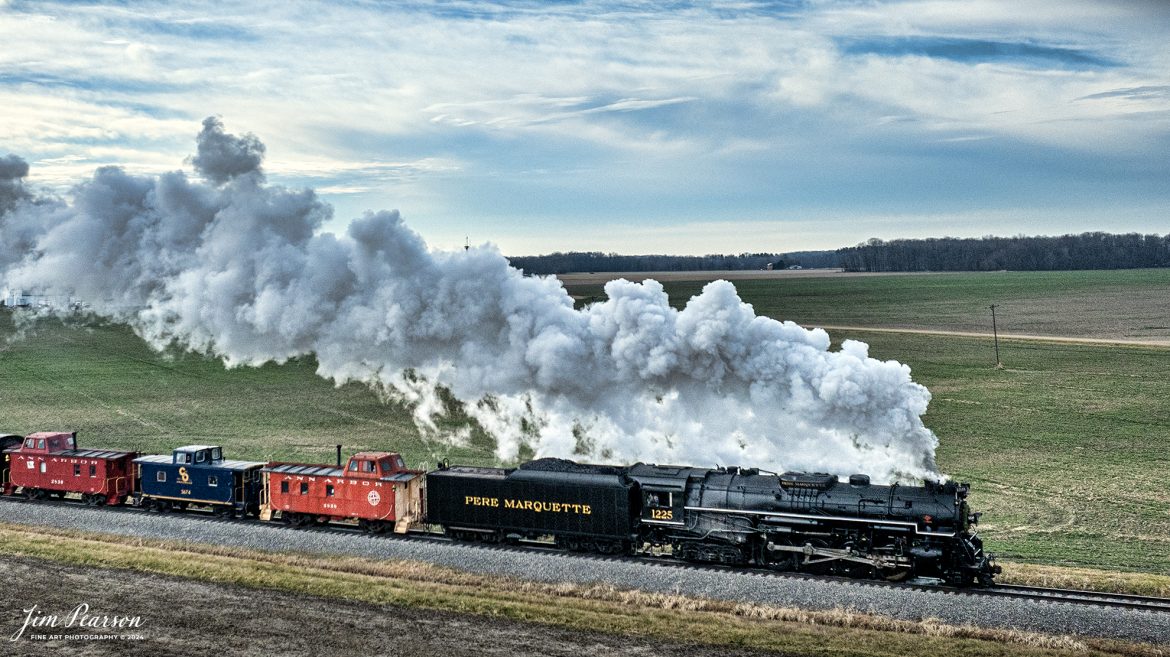 Steam Railroading Institute’s Pere Marquette 1225 makes its way through the Michigan countryside, as they run one of their last North Pole Express passenger train between Owosso and to the Village of Ashley, Michigan, for their Ashley Country Christmas, on December 16th, 2023. 

According to their website, Pere Marquette 1225, the largest and most impressive piece in the Steam Railroading Institute’s collection, is one of the largest operating steam locomotives in Michigan. The 1225 was built in October of 1941 by the Lima Locomotive Works in Lima, Ohio for the Pere Marquette Railway. It’s part of the National Register of Historic Structures and is renowned for its role in the 2004 Warner Brothers Christmas Classic, THE POLAR EXPRESS™. 1225’s blueprints were used as the prototype for the locomotive image as well as its sounds to bring the train in the animated film to life!

Tech Info: DJI Mavic 3 Classic Drone, RAW, 22mm, f/2.8, 1/3200, ISO 160.

#railroad #railroads #train #trains #bestphoto #railroadengines #picturesoftrains #picturesofrailway #bestphotograph #photographyoftrains #trainphotography #JimPearsonPhotography #steamtrains #trending
