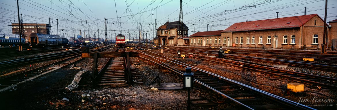 An unusual site as no trains are moving in this panoramic photo shot from the end of one of the platforms at the Frankfurt (Main) Hauptbahnhof (train station) in Frankfurt, West Germany in the fall of 1985.
I lived outside of Frankfurt from 1978-1981 and went back on photo assignments for the Air Force almost every year afterwards until I retired in 1995.
The Frankfurt station was one of my favorite locations to photograph trains and on many weekends, you could find me hanging out here shooting photos. This shot was from one of my trips in 1985 and since this station is super busy with 25 mainline platforms in the station! During the time I lived in Germany is probably where I really started photographing trains as I traveled by train all the time there and had some great friends, The Grant Family, that were also into trains. We typically were off somewhere in Europe on many weekends, and I fell into a deeper love and appreciation for them during my time there.

According to The Man in Seat 61 website: Frankfurt am Main Hauptbahnhof (usually abbreviated to Hbf = main station in German) is an impressive terminus at the center of the busy city of Frankfurt, Germany, a beautiful station dating from 1888, although the halls either side of the main hall were added in 1924

Photo was shot with a Fuji 6X17 Panoramic Camera with a 105mm lens.

#trainphotography #railroadphotography #trains #railways #jimpearsonphotography #trainphotographer #railroadphotographer #Germany #FrankfurtHBF