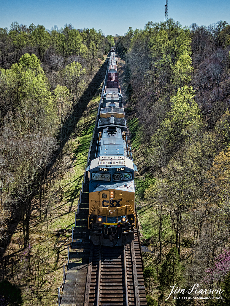CSXT 7014 leads CSX M502, Radnor Yard - Nashville, TN - Clearing Yard - Chicago, IL, as heads north across Gum Lick, just north of Kelly, Ky on April 6th, 2024, with an mixed freight train, on the CSX Henderson Subdivision.

Tech Info: DJI Mavic 3 Classic Drone, RAW, 22mm, f/2.8, 1/200, ISO 150.