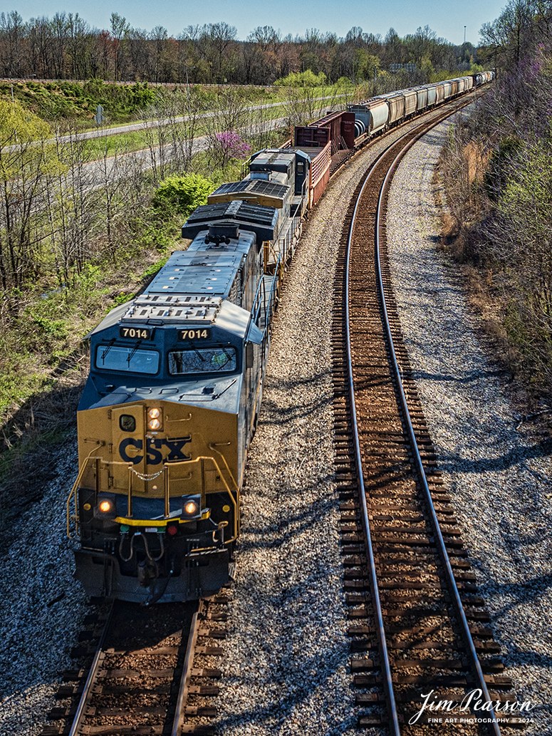 CSX 7014 leads M502 as they round the curve at Romney, just south of Nortonville, Kentucky as they head north on April 6th, 2024, on the CSX Henderson Subdivision.

Tech Info: DJI Mavic 3 Classic Drone, RAW, 22mm, f/2.8, 1/1600, ISO 230.