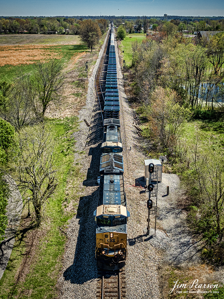 CSXT 3329 leads CSX M512, Radnor Yard - Nashville, TN - Clearing Yard - Chicago, IL, passes the signals at the north end of Crofton, Ky, on April 6th, 2024, with a mixed freight train, on the CSX Henderson Subdivision.

Tech Info: DJI Mavic 3 Classic Drone, RAW, 22mm, f/2.8, 1/2000, ISO 140.