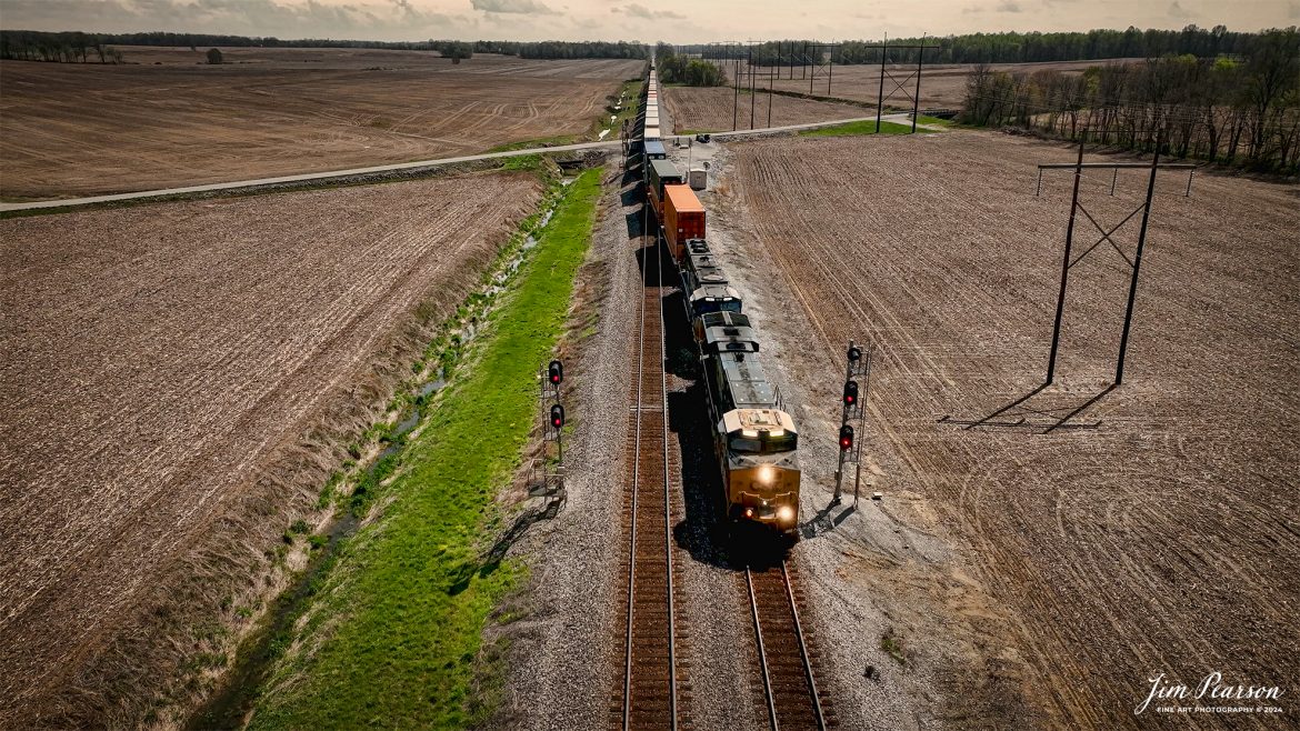 CSX I128 heads north as it takes the siding at the south end at Rankin, Ky on the Henderson Subdivision, as sunlight begins to reappear on the area during the April 8th, 2024, total eclipse event at 2:04pm CST. 

Tech Info: DJI Mavic 3 Classic Drone, RAW, 22mm, f/2.8, 1/180, ISO 480.