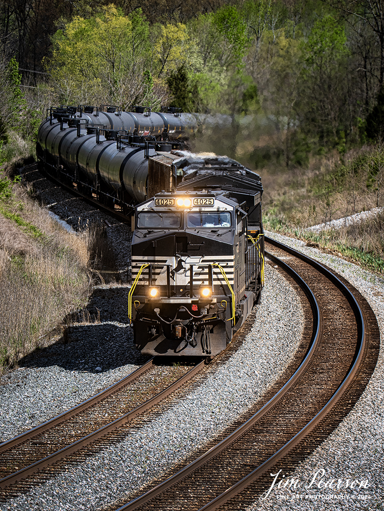 A loaded southbound ethanol train, CSX B621 with Norfolk Southern 4025, 3603 and CSXT 5481 on main 1 heads south through the S curve at Nortonville, Kentucky, on April 12th, 2024, on the CSX Henderson Subdivision.

The Henderson Subdivision sees foreign power quite often and this train is one example of it. This train runs from Bensenville, IL (CPKC) to Hookers Point - Tampa, FL, as needed.

Tech Info: Nikon D810, RAW, Sigma 150-600 @150mm, f/2.8, 1/800, ISO 160.

#railroad #railroads #train #trains #bestphoto #railroadengines #picturesoftrains #picturesofrailway #bestphotograph #photographyoftrains #trainphotography #JimPearsonPhotography