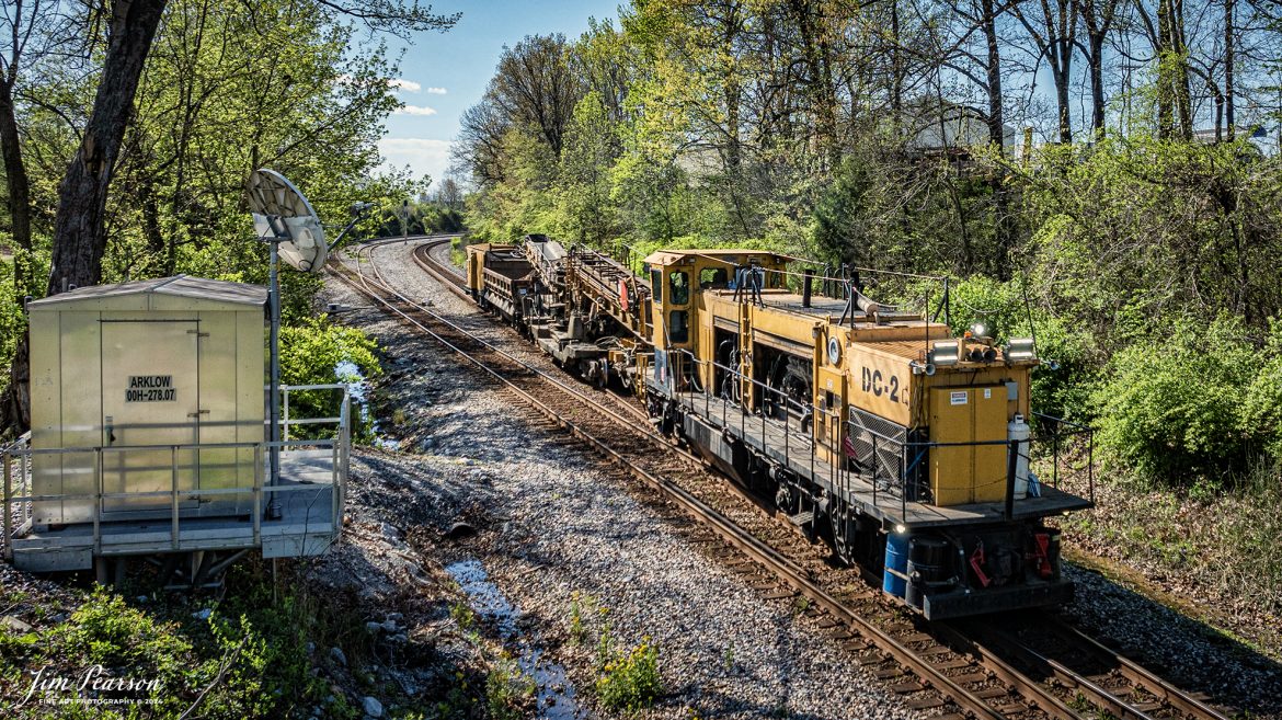 A Loram Badger Ditcher Machine, DC-2, heads north past Arklow at Madisonville, Kentucky, as W055-13, on April 12th, 2024, on the CSX Henderson Subdivision. 

According to their website: Loram’s Badger Ditcher is a self-propelled ditch cleaner that can move 1,000 tons of material every hour, excavating at up to 22 feet from the center of the track. The Loram ditch cleaner creates a properly sloped ditch that intercepts and diverts water away from the track. The ditcher’s high-speed, high-performance ditching wheel digs in and picks up mud and water. As the wheel digs the ditch, water begins to flow.

The Badger Ditcher helps manage, remedy, and prevent the damaging effects from a host of penetrating water sources, including direct precipitation, groundwater migration, springs and trapped water, saturation, and seepage. Ditch maintenance best practices using the Badger Ditcher lets railroads improve vital drainage for the subgrade, lower the water table, control run-off, and promote free flow from the ballast section that can extend the effective duration of undercutting and ballast cleaning cycles.

Tech Info: DJI Mavic 3 Classic Drone, RAW, 22mm, f/2.8, 1/1600, ISO 150.

#trainphotography #railroadphotography #trains #railways #jimpearsonphotography #trainphotographer #railroadphotographer #csxt #dronephoto #trainsfromadrone #trending #csxhendersonsubdivision #trainsfromadrone