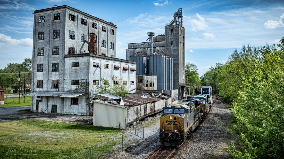 CSX intermodal, I026, passes the old Perdue AgriBusiness - Hopkinsville Grain Elevator at Hopkinsville, Kentucky, as they head north on a beautiful spring afternoon, on April 15th, 2024, along the CSX Henderson Subdivision.

Tech Info: DJI Mavic 3 Classic Drone, RAW, 22mm, f/2.8, 1/2500, ISO 200.