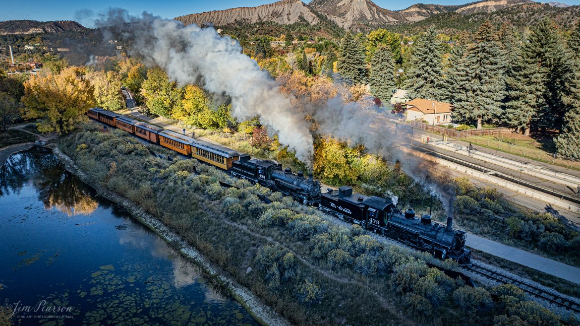 Denver and Rio Grande Western double header steam locomotives 473 and 493 pull south out of Durango with a daily passenger train, bound for Silverton, Colorado on October 15th, 2023.

According to Wikipedia: The Durango and Silverton Narrow Gauge Railroad, often abbreviated as the D&SNG, is a 3 ft (914 mm) narrow-gauge heritage railroad that operates on 45.2 mi (72.7 km) of track between Durango and Silverton, in the U.S. state of Colorado. The railway is a federally designated National Historic Landmark and was also designated by the American Society of Civil Engineers as a National Historic Civil Engineering Landmark in 1968.

Tech Info: DJI Mavic 3 Classic Drone, RAW, 22mm, f/2.8, 1/1250, ISO 170.

#railroad #railroads #train #trains #bestphoto #railroadengines #picturesoftrains #picturesofrailway #bestphotograph #photographyoftrains #trainphotography #JimPearsonPhotography #DurangoandSilvertonRailroad #trending