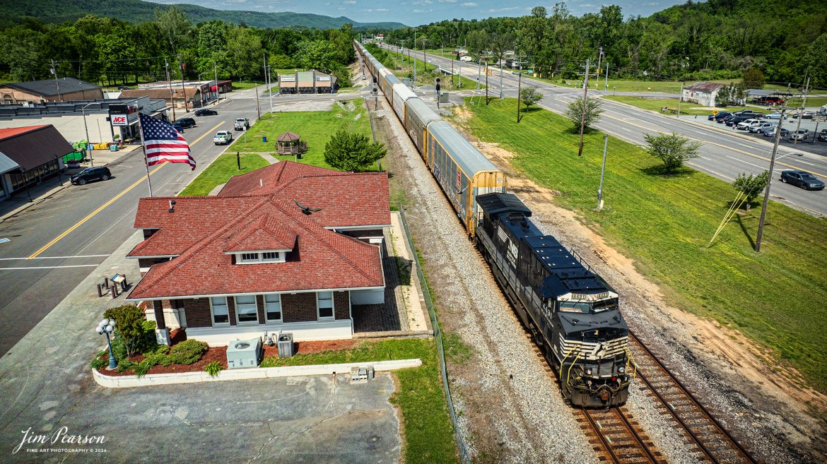Norfolk Southern 189 Autorack train heads south at past the NS CNO&TP Third District as they pass the old depot in downtown Spring City, Tennessee on April 28th, 2024.

According to https://theclio.com website: The restored railroad depot was built In 1900 by the Queen and Crescent Railroad Company that extended out of Cincinnati Ohio built for the purposes of extending travel and commerce to the south. 

In addition to it's function of providing access to the southern areas of the United States, the Depot eventually became a museum that chronicled the story of a group of female rebels dubbed "The Rhea County Spartans." During the course of the Civil War these Women Served as spies for the Confederate Army. However they were eventually caught and as a result of their actions they were arrested and sent 54 miles to the Market Street in Chattanooga. It was there that they were forced to swear allegiance to the Union before being sent back home on foot.

Today it houses the Spring City History Museum.

Tech Info: DJI Mavic 3 Classic Drone, RAW, 24mm, f/2.8, 1/2000, ISO 100.

#trainphotography #railroadphotography #trains #railways #dronephotography #trainphotographer #railroadphotographer #jimpearsonphotography #trains #bnsf #mavic3classic #drones #trainsfromtheair #trainsfromadrone #NorfolkSouthern #TennesseeTrains #CNOTP