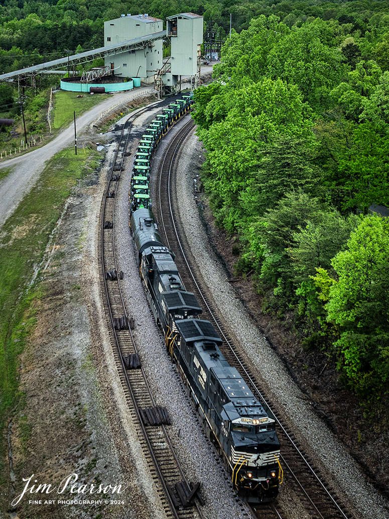Norfolk Southern 4413 and 9783 lead 29F as they pass the old mine loadout at Revelo outside Sterns, Kentucky with their train, which includes 10 flats loaded with John Deere Tractors behind the power, as they head south on NS CNO&TP (Rathole) Subdivision, on April 29th, 2024. stormy skies.

Tech Info: DJI Mavic 3 Classic Drone, RAW, 24mm, f/2.8, 1/640, ISO 120.

#trainphotography #railroadphotography #trains #railways #dronephotography #trainphotographer #railroadphotographer #jimpearsonphotography #trains #bnsf #mavic3classic #drones #trainsfromtheair #trainsfromadrone #NorfolkSouthern #TennesseeTrains #CNOTP