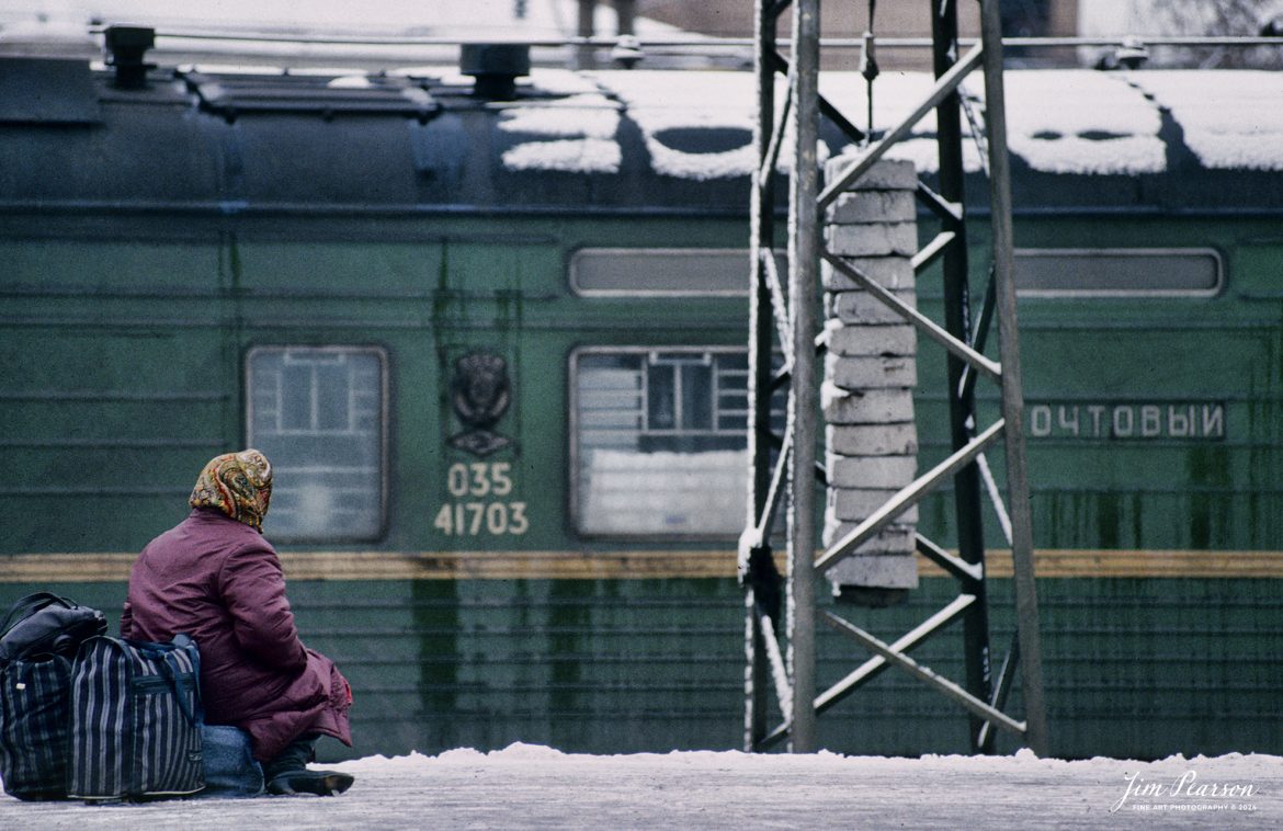 A lady waits for the arrival of her train at the main train station in downtown Moscow, Russia sometime during the winter months of 1992. This image is from a slide scan that I shot while I was taking part in a military humanitarian called Provide Hope.

For awhile I was the non-commissioned officer in charge of the Air Force’s Electronic Imaging Center stationed at Aviano, Italy, where Combat Camera was tasked to document the Provide Hope operation. I was there for six months, and we flew missions in and out of the USSR. This was on one trip to Moscow where we spent a couple days in the country, documenting the delivery of supplies to an orphanage. Of course, during my off time, I made sure to visit the train station that was just outside our hotel! 

According to Wikipedia:  Operation Provide Hope was a humanitarian operation conducted by the U.S. Air Force to provide medical equipment to former Soviet republics during their transition to capitalism. The operation was announced by Secretary of State James A. Baker, III on January 22–23, 1992 and the initial shipment of supplies was sent on February 10, 1992. Twelve US Air Force C-5 and C-141 was carrying an estimated 500 tons of bulk-food rations and medicines into Moscow, St. Petersburg, Kyiv, Minsk, and Chisinau from Germany and Yerevan, Almaty, Dushanbe, Ashkhabad, Baku, Tashkent, and Bishkek from Turkey. In total, for nearly two weeks sixty-five missions flew 2,363 short tons (2,144 t) of food and medical supplies to 24 locations in the Commonwealth of Independent States during the initial phase of operation. Much of these supplies was left over from the buildup to the Persian Gulf War.

Small teams of US personnel from various government agencies (On-Site Inspection Agency, USAID, and USDA) had been placed in each destination shortly before the deliveries, to coordinate with local officials and to monitor to the best extent possible that the deliveries reached the intended recipients (i.e., orphanages, hospitals, soup kitchens, and needy families).

#trainphotography #railroadphotography #trains #railways #jimpearsonphotography #trainphotographer #railroadphotographer #Russia #Moscow