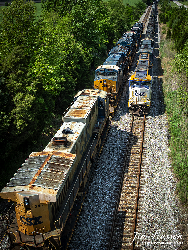 CSX M512 heads north as it meets southbound M503 with the Operation Lifesaver Engine 4568 leading, at the south end of Slaughters, Kentucky on April 30th, 2025, on the CSX Henderson Subdivision. 

M512 was hauling three wrecked locomotives, CSXT 3469, 3299 and 245, on flats behind the head end power. From what I understand the units were from the signal suspension head on wreck in Folkston, GA last year. CSXT 245 was on the rock train and the other two were on I032.

Tech Info: DJI Mavic 3 Classic Drone, RAW, 24mm, f/2.8, 1/1600, ISO 100.

#railroad #railroads #train, #trains #railway #railway #steamtrains #railtransport #railroadengines #picturesoftrains #picturesofrailways #besttrainphotograph #bestphoto #photographyoftrains #bestsoldpicture #JimPearsonPhotography #trainsfromtheair #trainsfromadrone