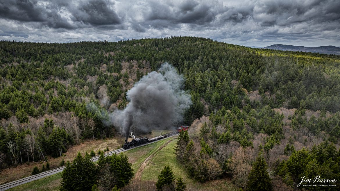 Cass Scenic Railroad Heisler#6 pulls up the hill approaching Bald Knob, WV during the Cass Spring Photographers Special, from Cass, West Virginia on May 3rd, 2025. 

According to the Mountain Rail West Virginia Website: The Meadow River Lumber No. 6 was built by the Heisler Locomotive Works in Erie, PA, in 1929 for the Bostonia Coal & Clay Products Company of New Bethlehem, PA.

The Heisler was sold to the Meadow River Lumber Company at Rainelle, WV in 1939, where it was rostered as No. 6. She retired from the lumber company in 1965 and was purchased by the purchased it by the state of West Virginia purchased. The engine ran under its own steam from Rainelle to its new home in Cass in December 1966. No. 6 would begin operating on the railroad in 1968. The Heisler is the fastest geared locomotive in the Cass collection.

Tech Info: DJI Mavic 3 Classic Drone, RAW, 24mm, f/2.8, 1/2500, ISO 230.

#railroad #railroads #train, #trains #railway #railway #steamtrains #railtransport #railroadengines #picturesoftrains #picturesofrailways #besttrainphotograph #bestphoto #photographyoftrains #bestsoldpicture #JimPearsonPhotography #trainsfromtheair #trainsfromadrone #steamtrain #casssenicrailway