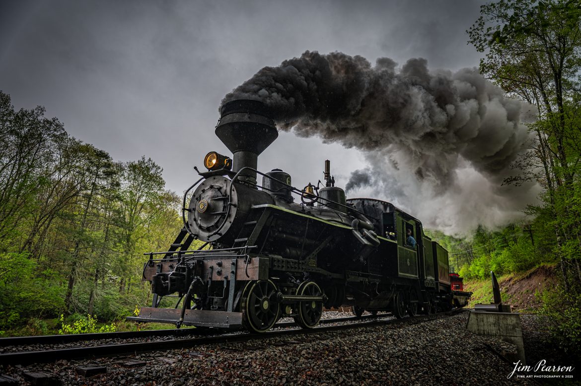 Fireman Brown Culp keeps a watchful eye on the track ahead from Cass Scenic Railway Heisler #6 as they pull across the recently constructed Trout Run Bridge on the way to Durban, West Virginia, during the Cass Spring Photographers Special, from Cass, West Virginia on May 4th, 2025. 

According to the Mountain Rail West Virginia Website: The Meadow River Lumber No. 6 was built by the Heisler Locomotive Works in Erie, PA, in 1929 for the Bostonia Coal & Clay Products Company of New Bethlehem, PA.

The Heisler was sold to the Meadow River Lumber Company at Rainelle, WV in 1939, where it was rostered as No. 6. She retired from the lumber company in 1965 and was purchased by the purchased it by the state of West Virginia purchased. The engine ran under its own steam from Rainelle to its new home in Cass in December 1966. No. 6 would begin operating on the railroad in 1968. The Heisler is the fastest geared locomotive in the Cass collection.

Tech Info: Nikon Z6ii, RAW, Nikon 24-70 @ 24mm, f/5.3, 1/400, ISO 100.

#railroad #railroads #train, #trains #railway #railway #railtransport #railroadengines #picturesoftrains #picturesofrailways #besttrainphotograph #bestphoto #photographyoftrains #bestsoldpicture #JimPearsonPhotography #steamtrain #casssenicrailway