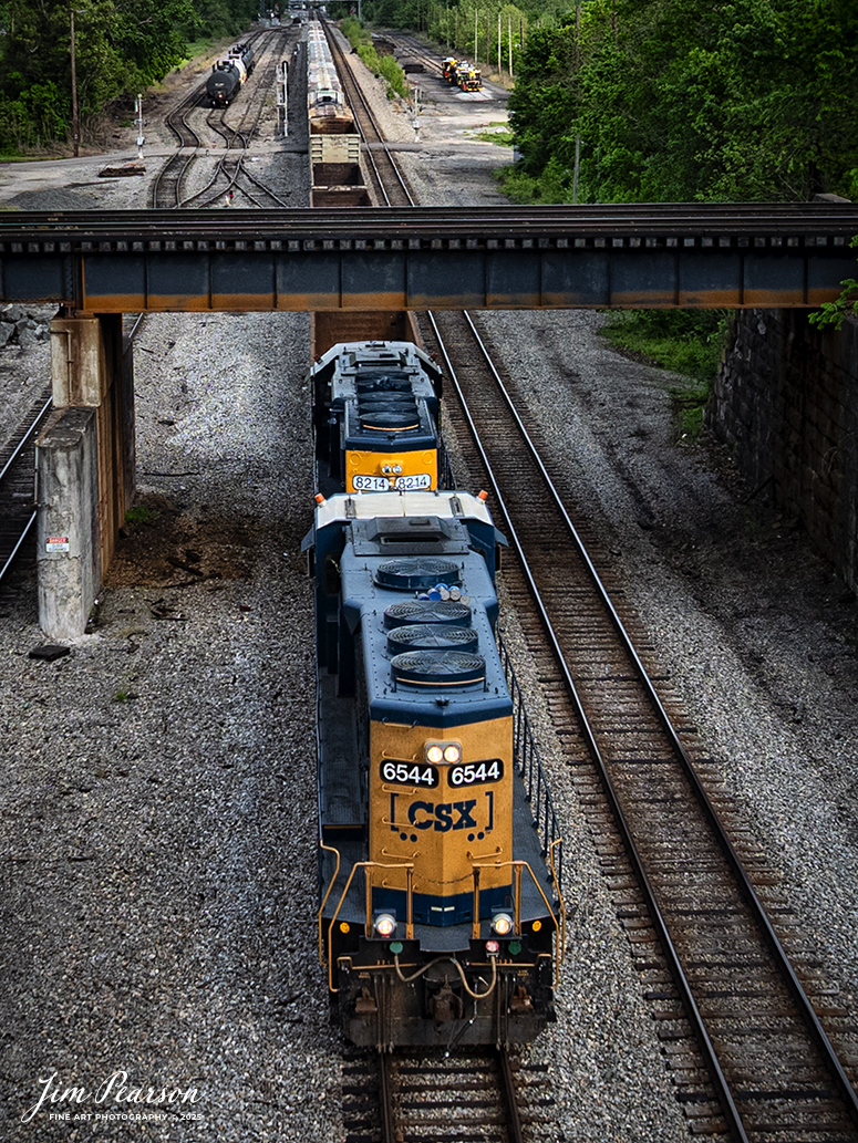 A CSX local running long nose forward passes under the Norfolk Southern Kenova District, as it heads west on the CSX Kanawha Subdivision at Kenova, on May 2nd, 2025.

Tech Info: DJI Mavic 3 Classic Drone, RAW, 24mm, f/2.8, 1/1600, ISO 150.

#railroad #railroads #train, #trains #railway #railway #railtransport #railroadengines #picturesoftrains #picturesofrailways #besttrainphotograph #bestphoto #photographyoftrains #bestsoldpicture #JimPearsonPhotography #trainsfromtheair #trainsfromadrone #norfolksouthern