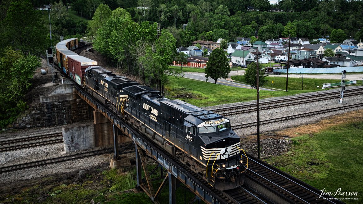 A Norfolk Southern mixed freight on the Kenova District, crosses over the CSX Kanawha Subdivision as it heads westbound at Kenova, on May 2nd, 2025.

Tech Info: DJI Mavic 3 Classic Drone, RAW, 24mm, f/2.8, 1/1600, ISO 240.

#railroad #railroads #train, #trains #railway #railway #railtransport #railroadengines #picturesoftrains #picturesofrailways #besttrainphotograph #bestphoto #photographyoftrains #bestsoldpicture #JimPearsonPhotography #trainsfromtheair #trainsfromadrone #norfolksouthern
